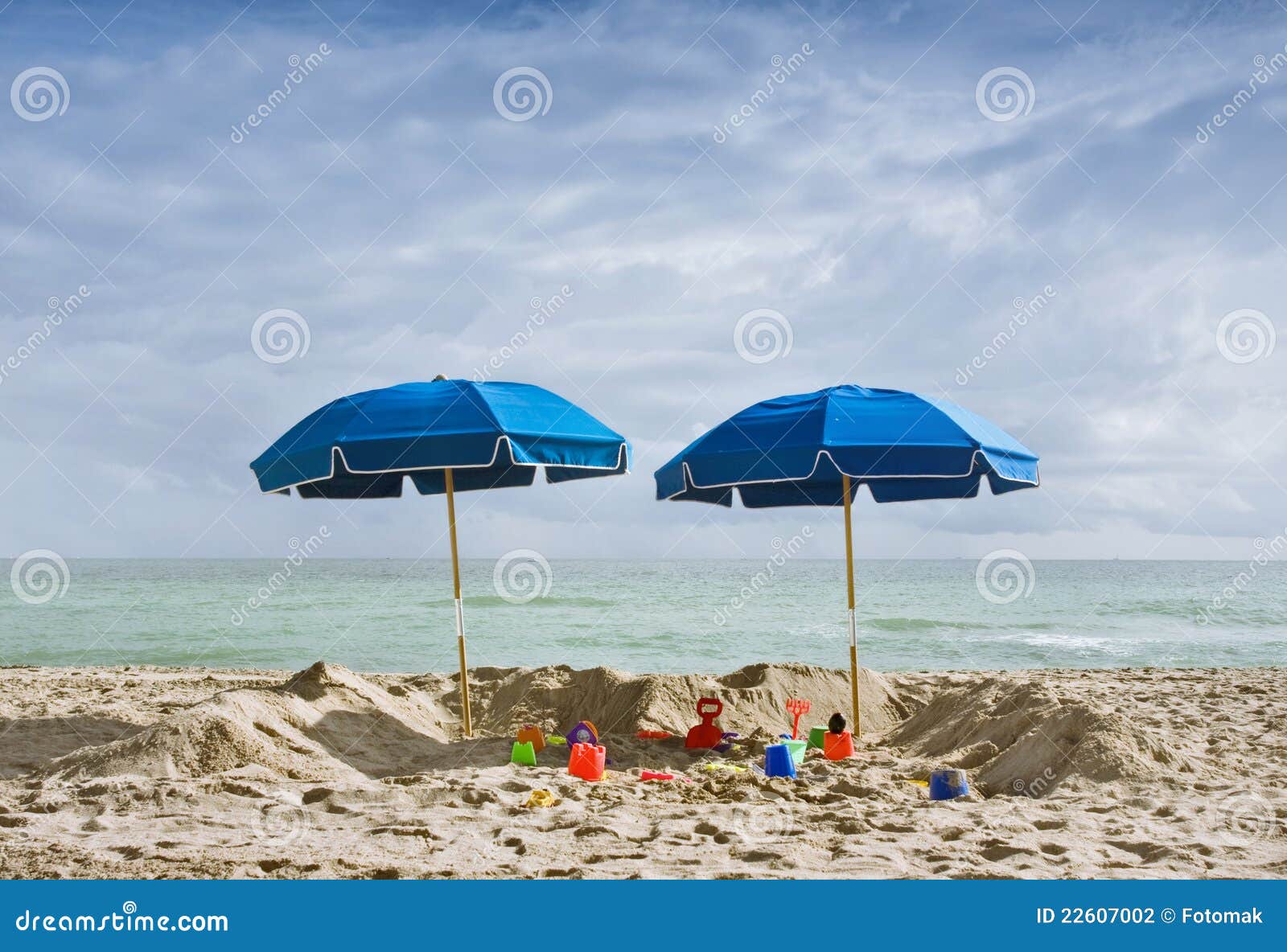 Two Blue Beach Umbrellas and Toys Stock Photo Image of objects, beach