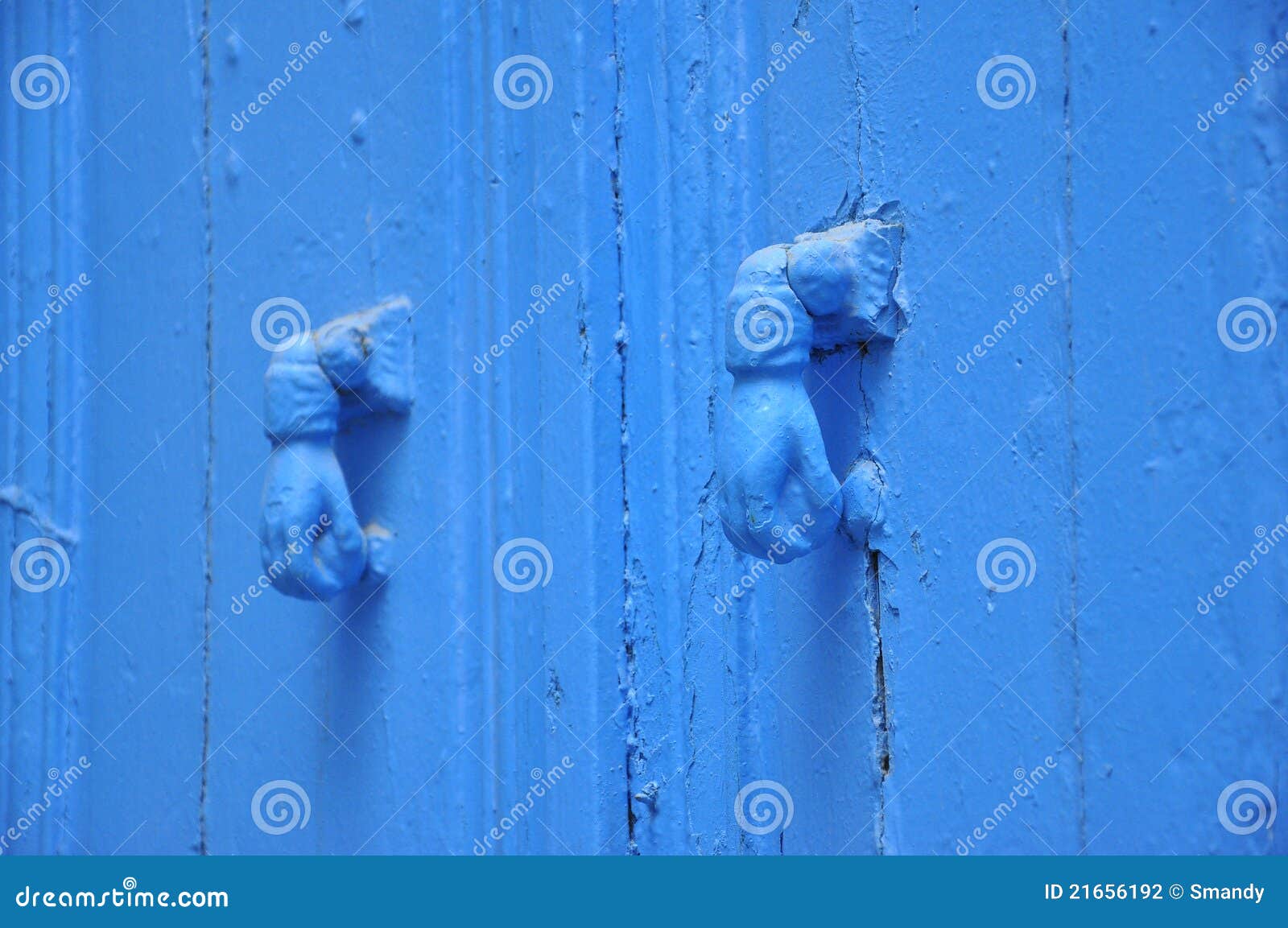two blue knockers hand , tunisian blue door