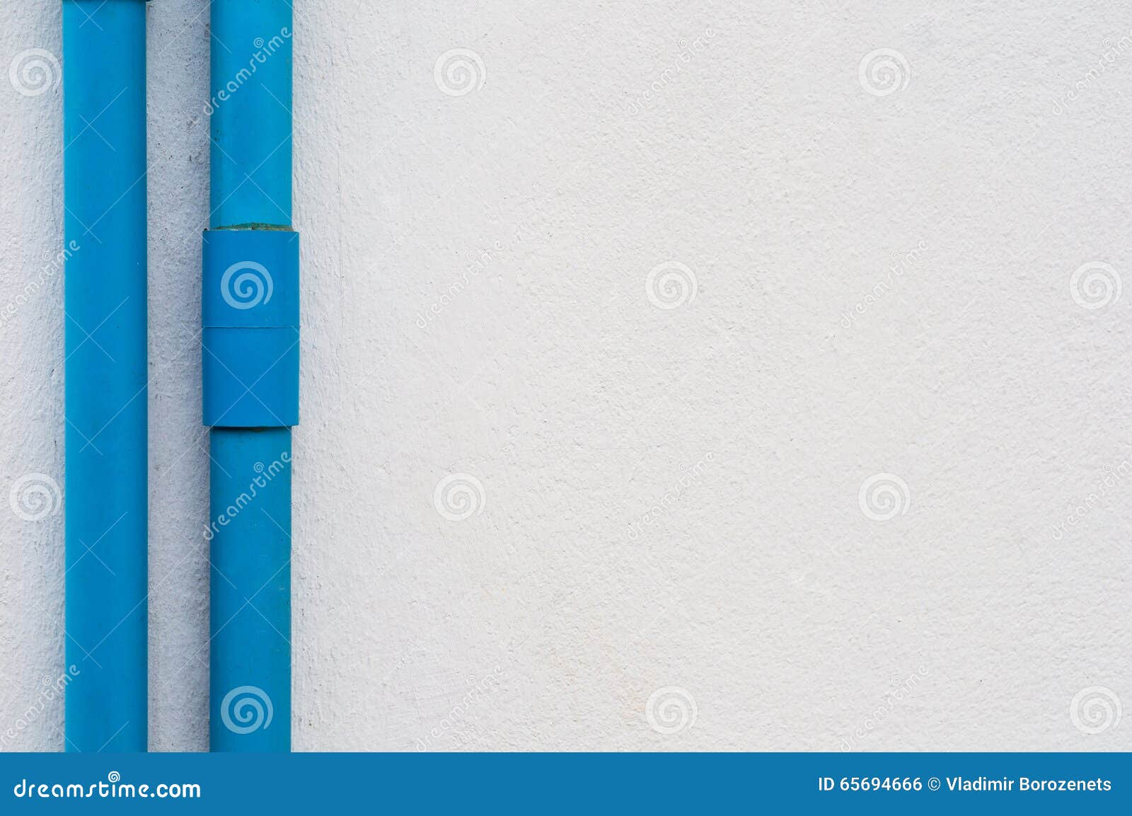 Two Blue PVC Pipes on White Concrete Wall Stock Photo Image of blue