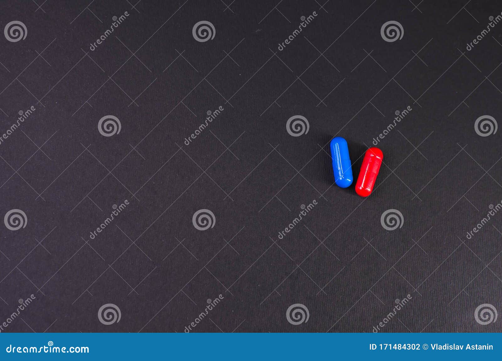 Two Blue and Red Tablets on a Black Background Stock Photo Image of