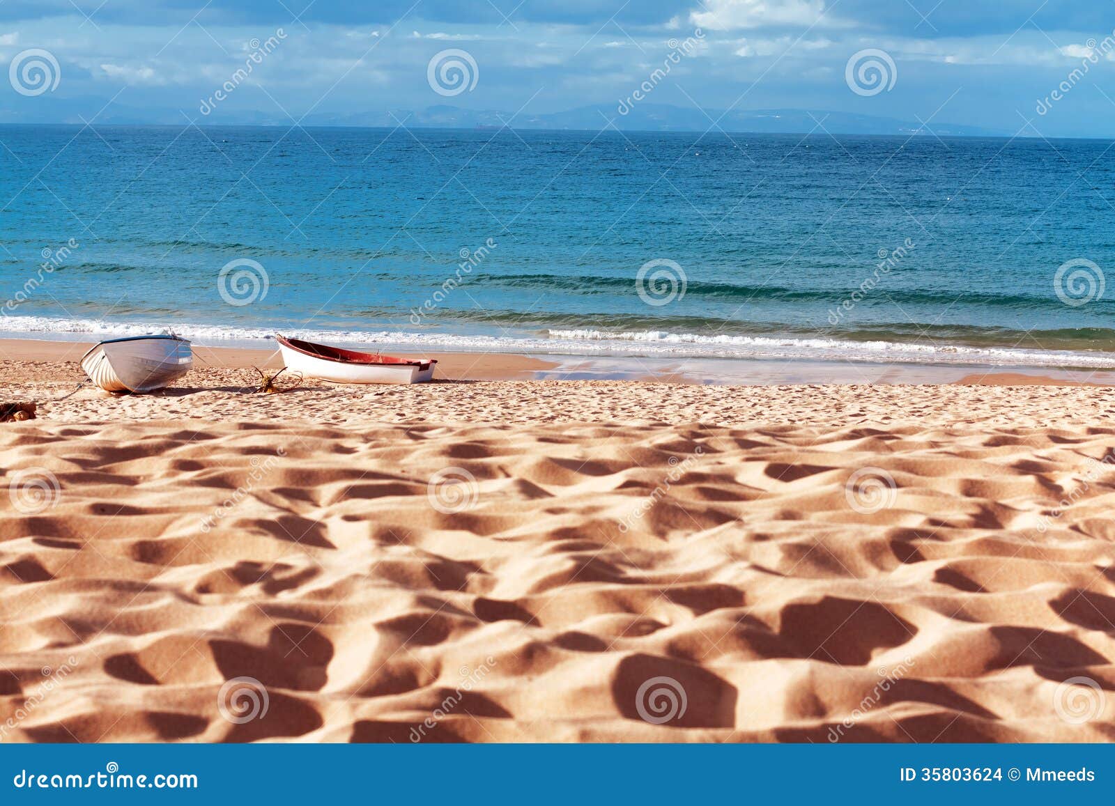 two boats on beach at bolonia beach, province cadiz, andalucia,