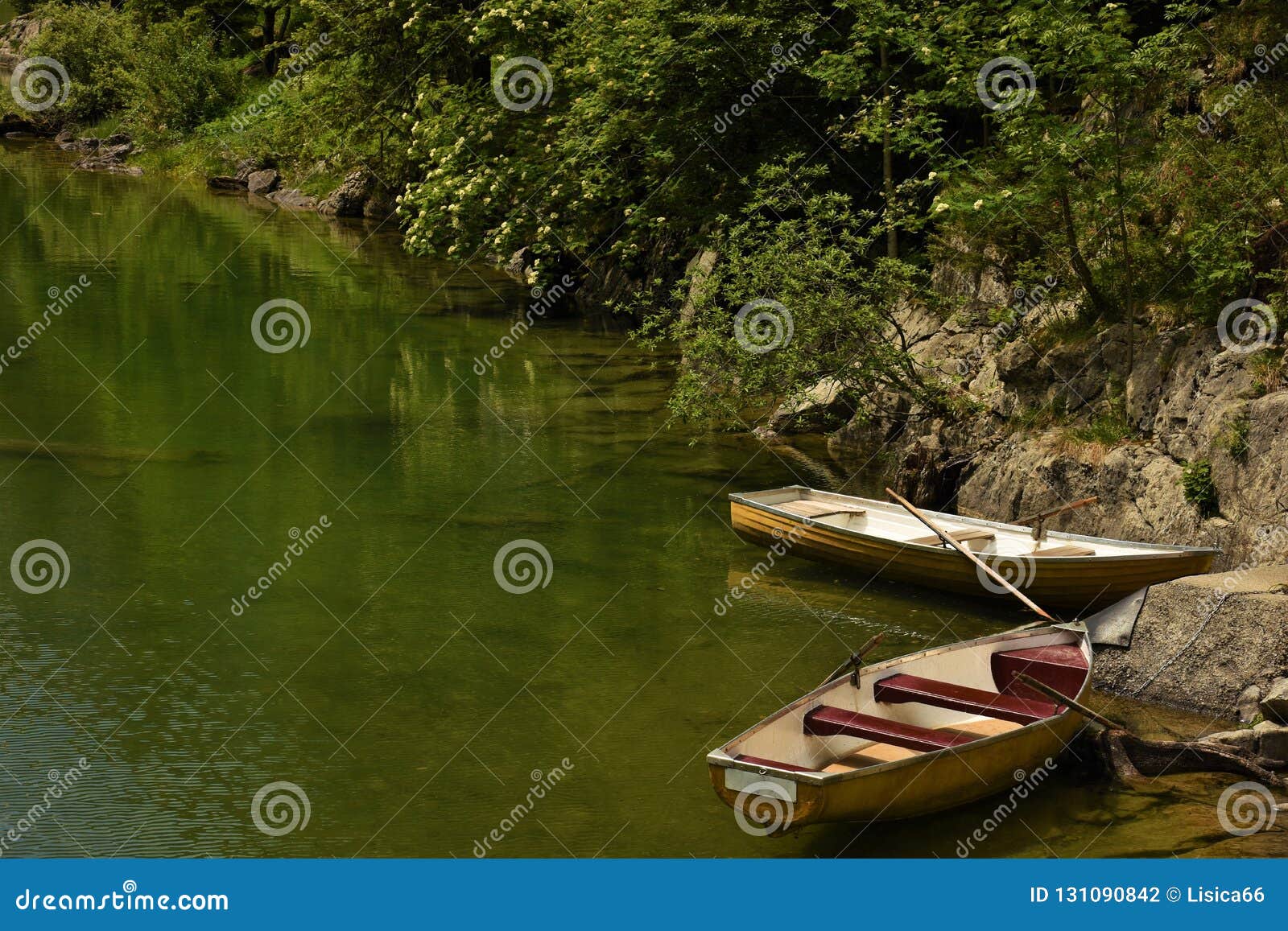 Two Boats on the Shore of a Mountain Lake Stock Photo - Image of boats ...