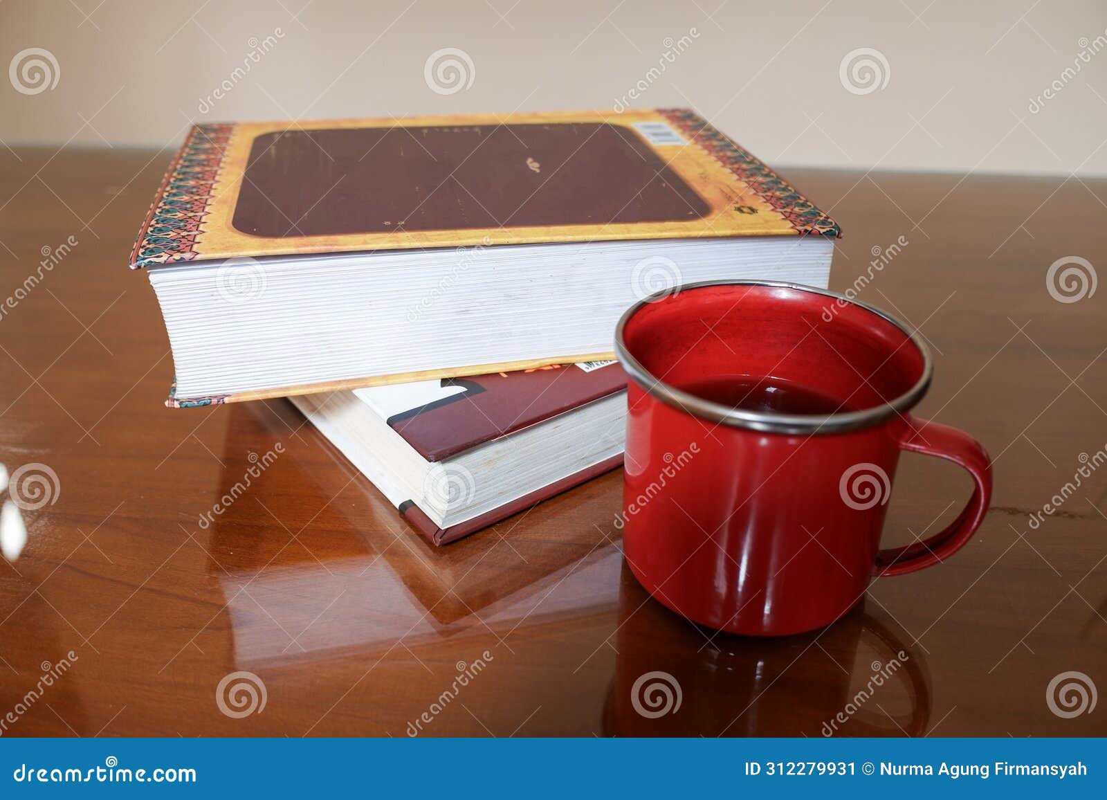 two books with a cup of coffee on a glassed table