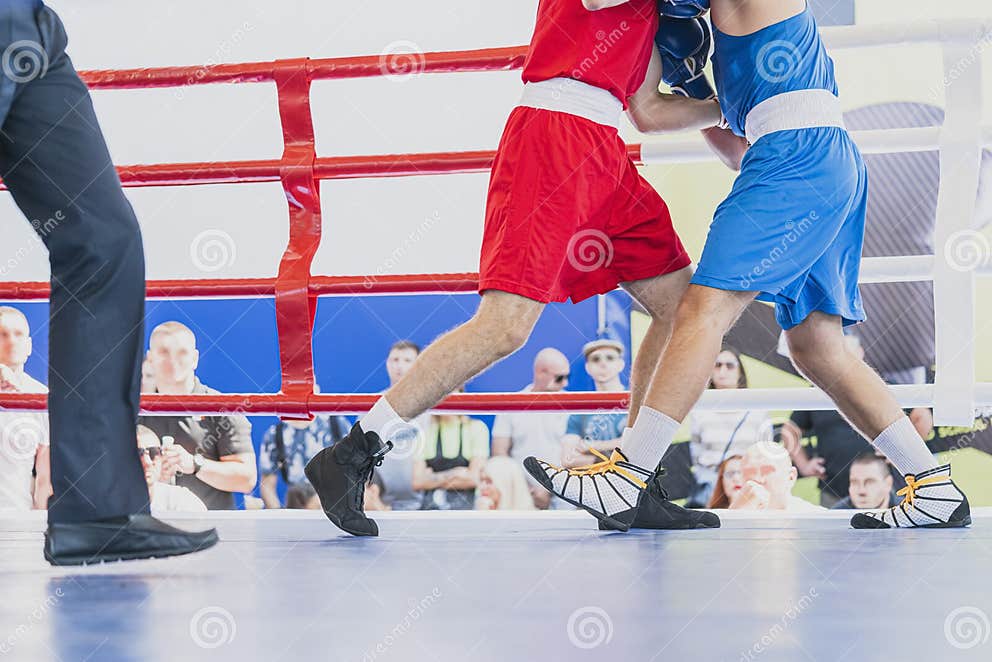 Boxing in the Ring. on the Foreground Boxers Legs. Horizontal Image