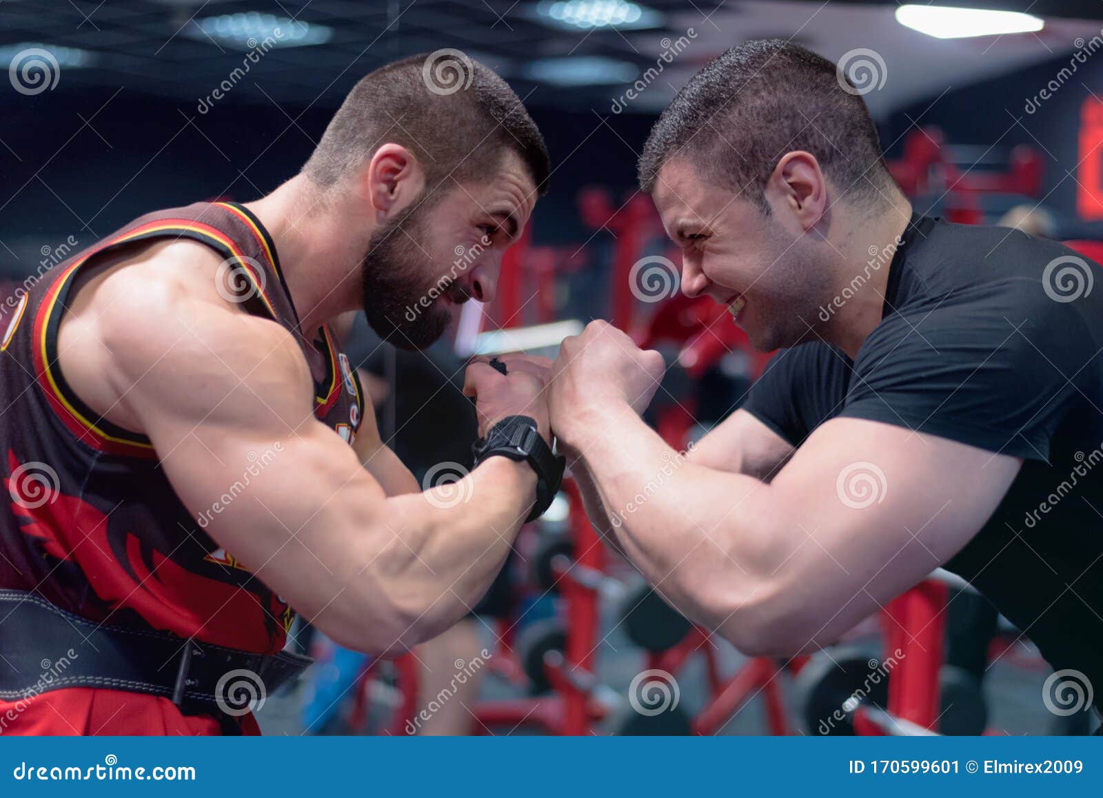 two boxers looking at each other very close and trying to intimidate the other before the fight. looking to each other with