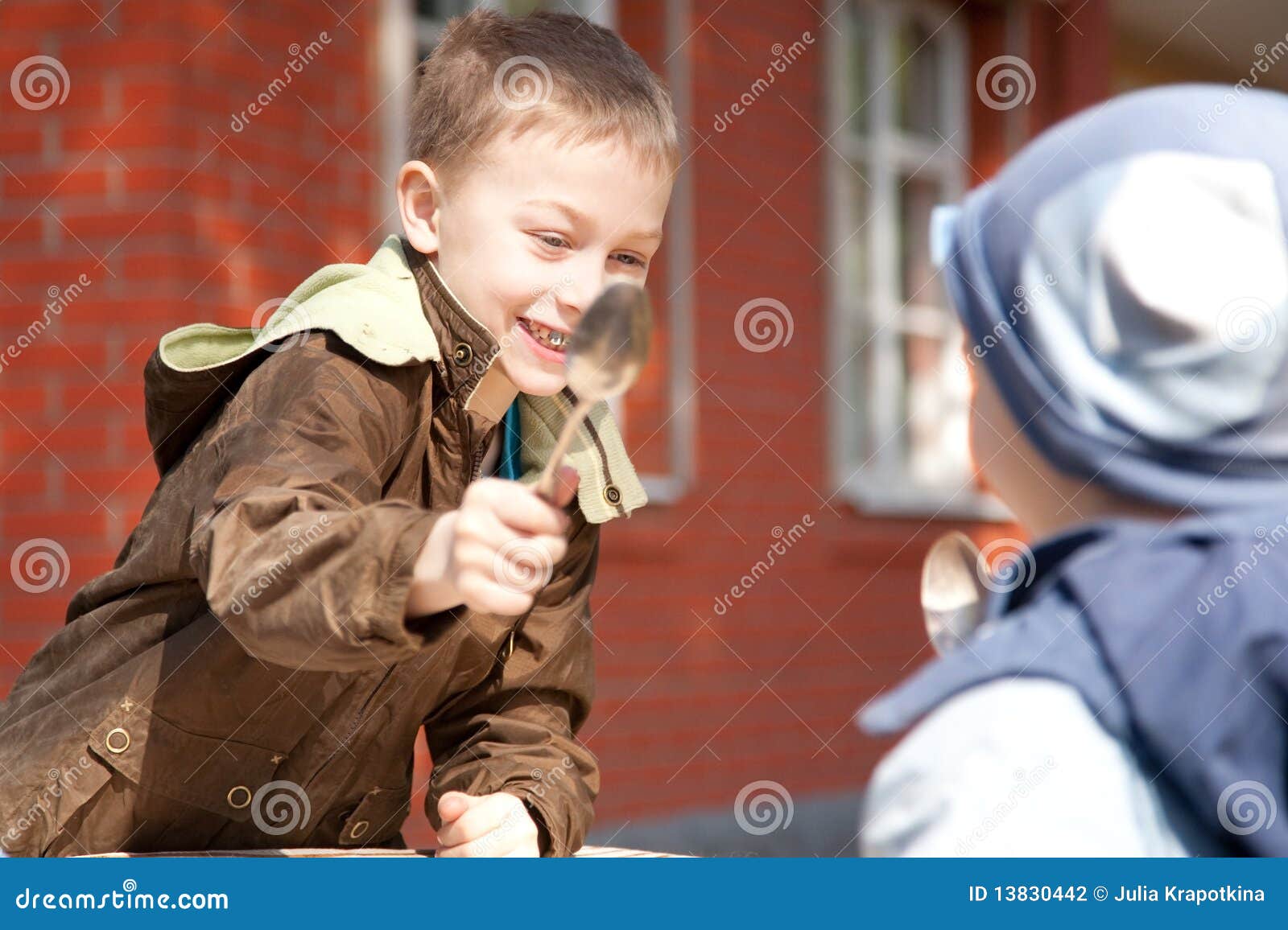 Two Boys Fighting with Spoons Stock Photo Image of spoon, garden