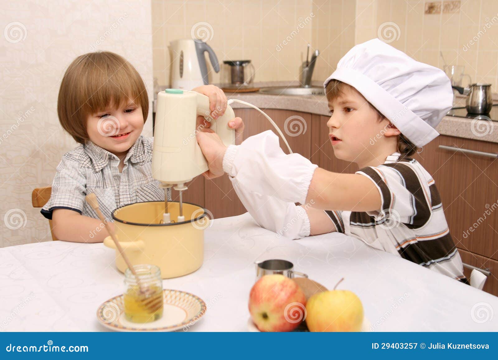 Two boys in kitchen stock image. Image of cook, plate 29403257