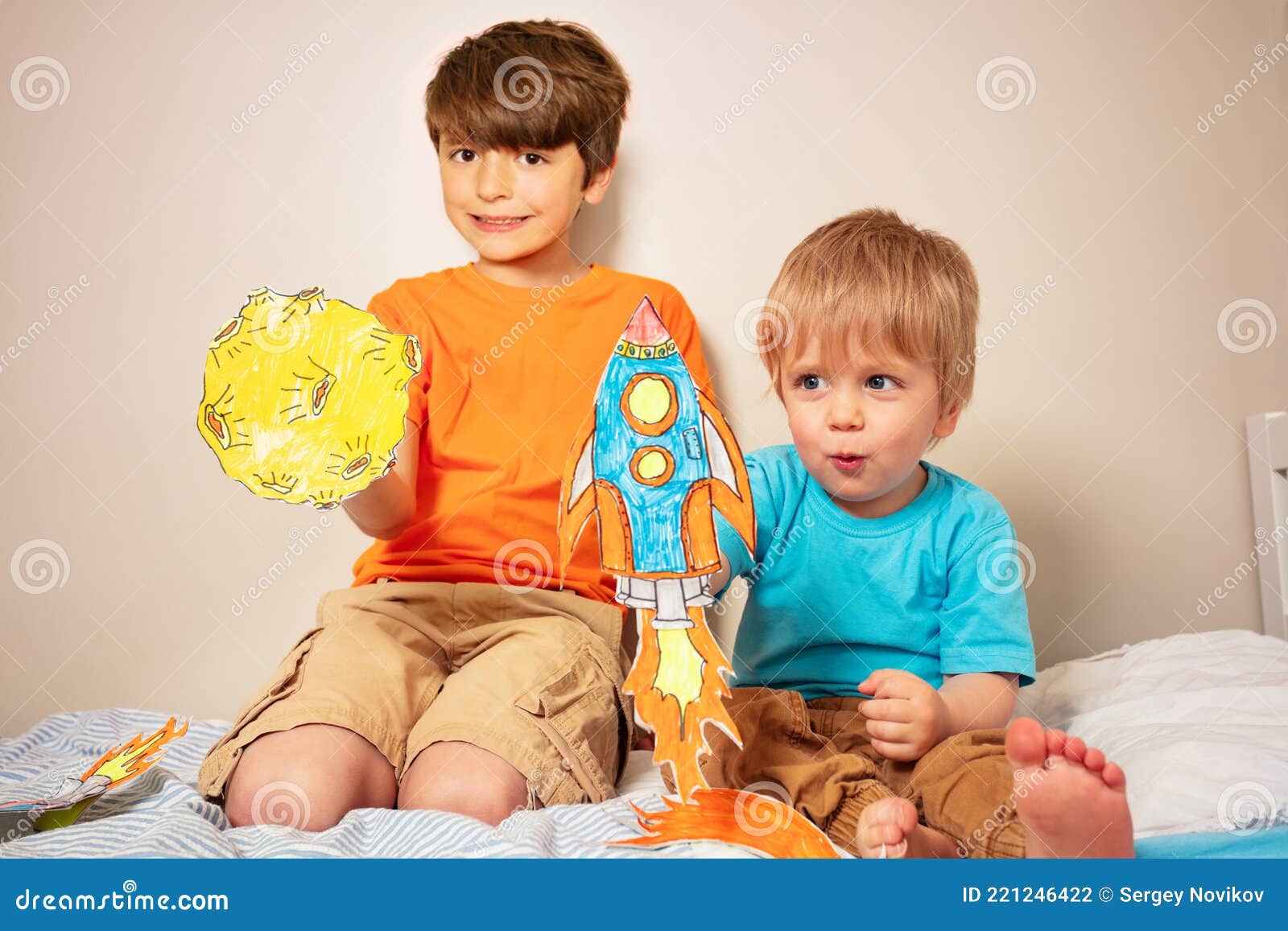 two boys play astronauts and rocker liftoff