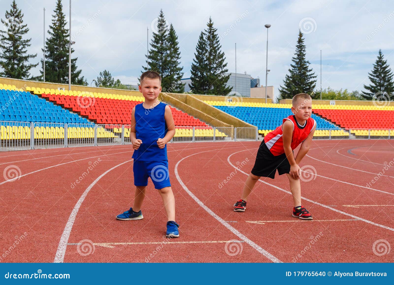 Two Boys are Preparing for the Start of a Sports Race at the Stadium. One  Hundred Meters Stock Photo - Image of race, driving: 179765640