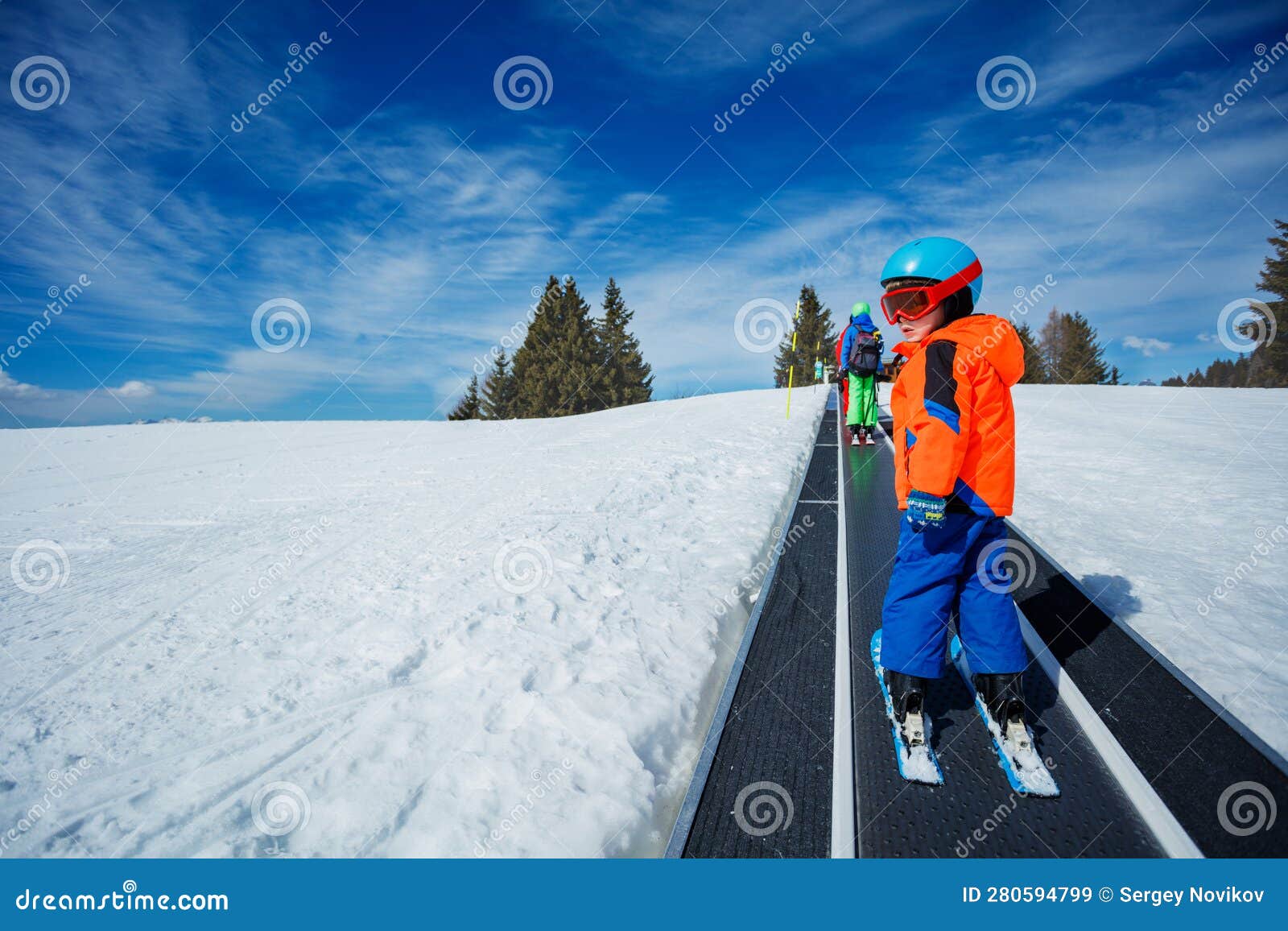 Two Boys on the Ski Moving Walkway Belt at Skiing School Stock Image ...