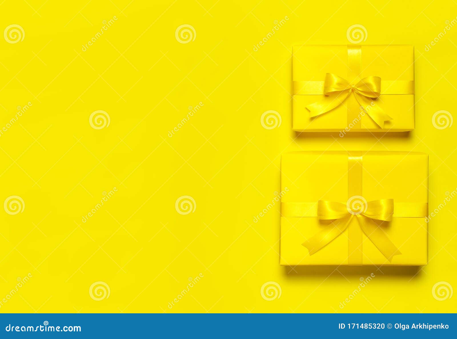Two Bright Yellow Gift Present Box With Ribbon And Bow On