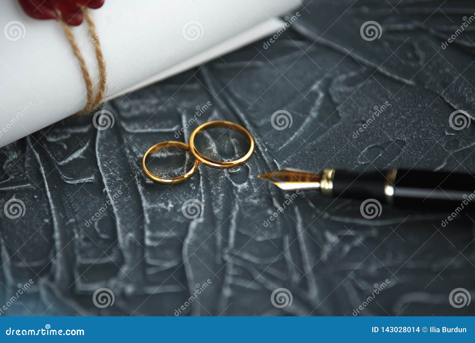 Two Broken Golden Wedding Rings Divorce Decree Document. Divorce and