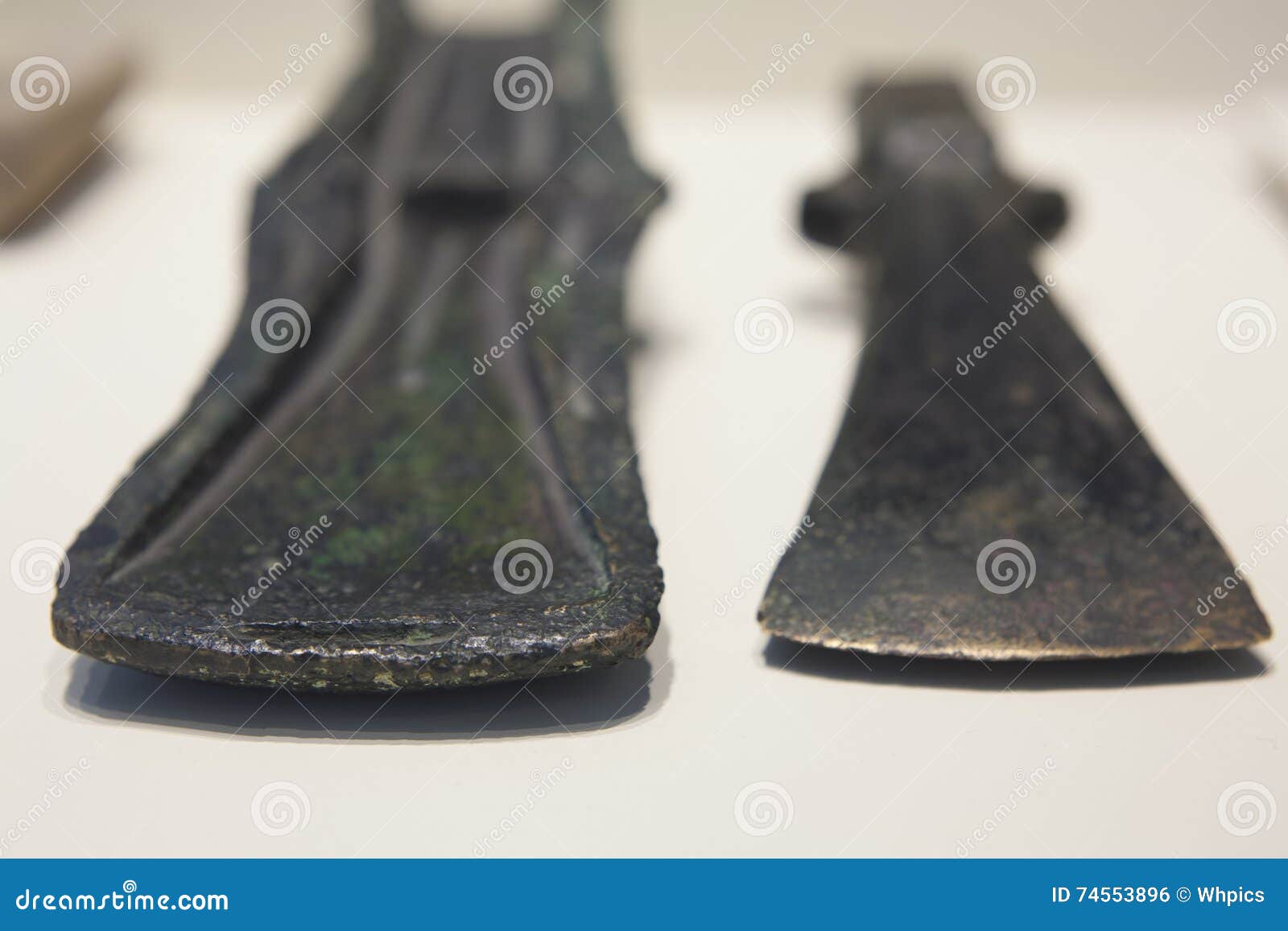two bronce age axe heads