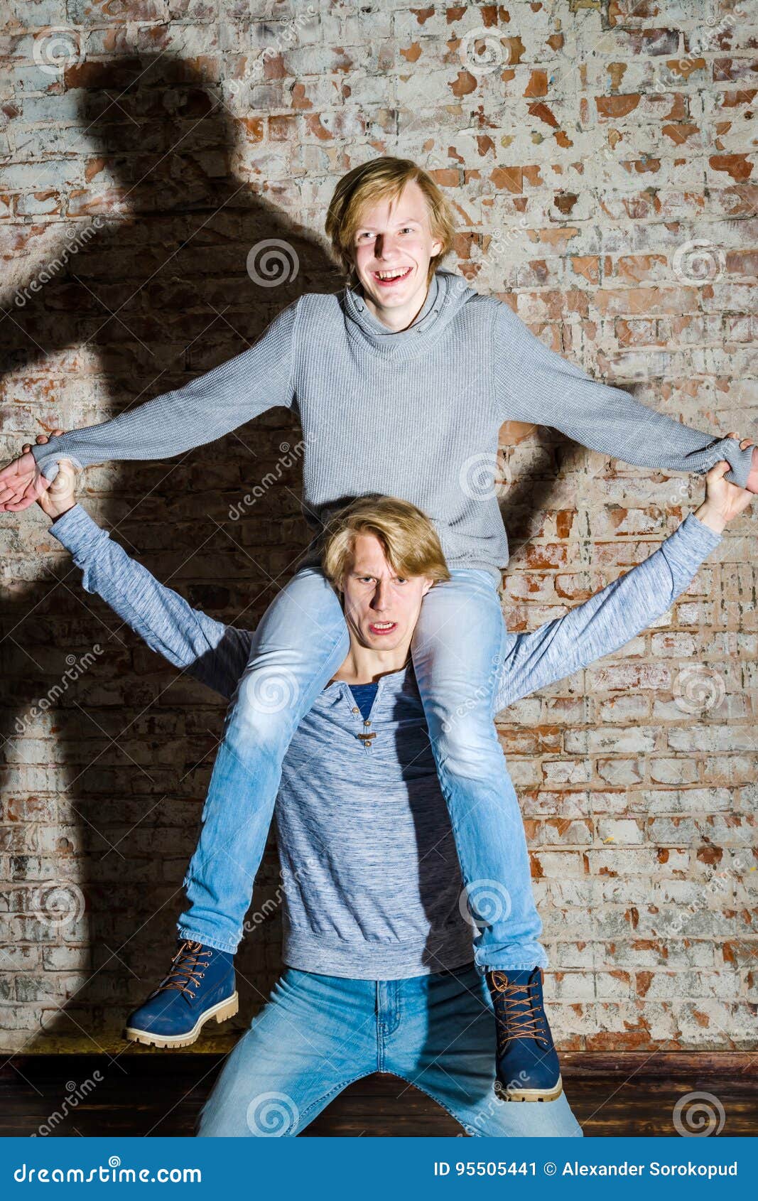 Two Brothers Posing At Home Smiling Family Portrait Stock Photo Picture  And Royalty Free Image Image 41584149