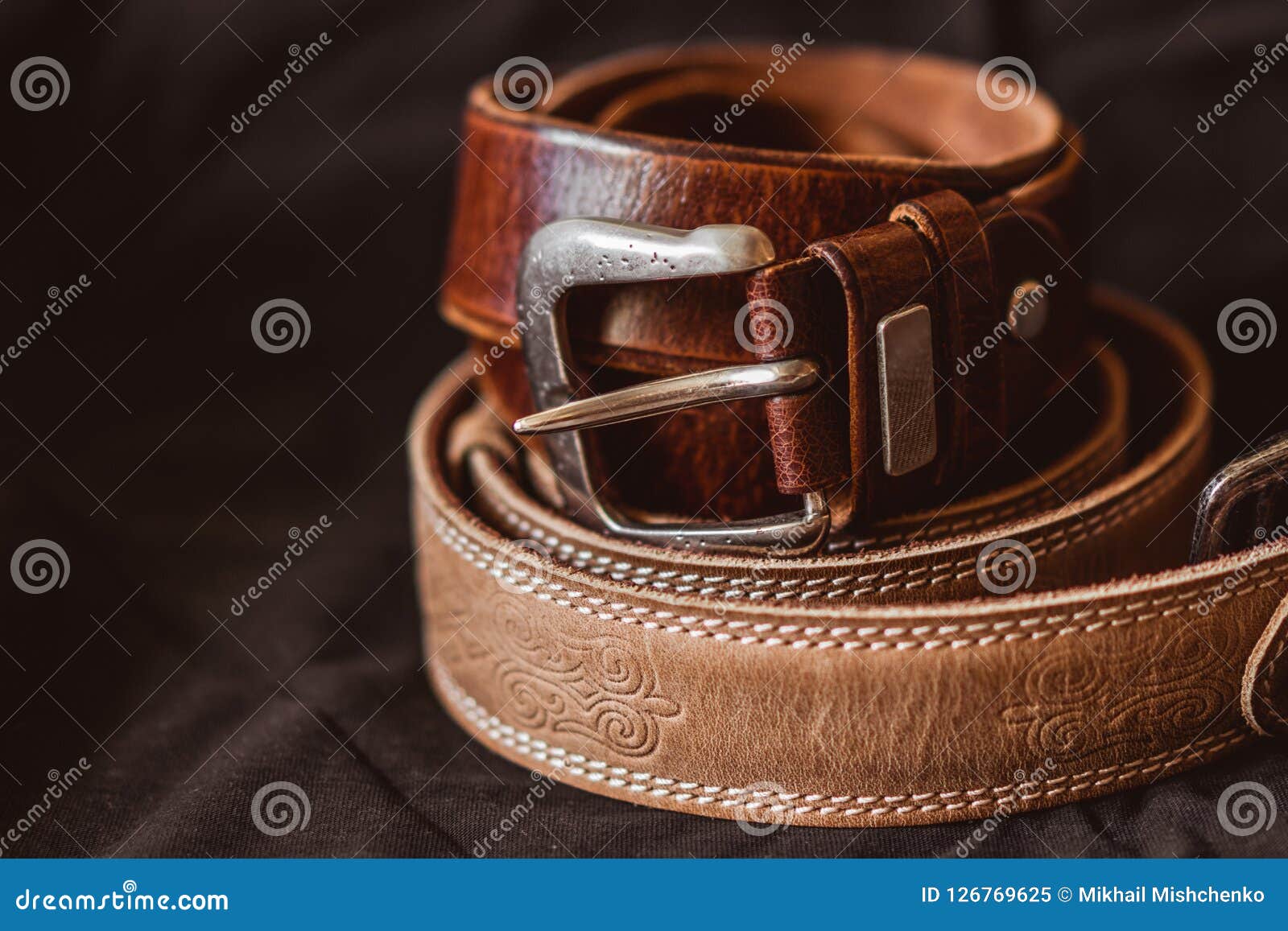 Two Brown Leather Belts On Dark Background Stock Image - Image of ...