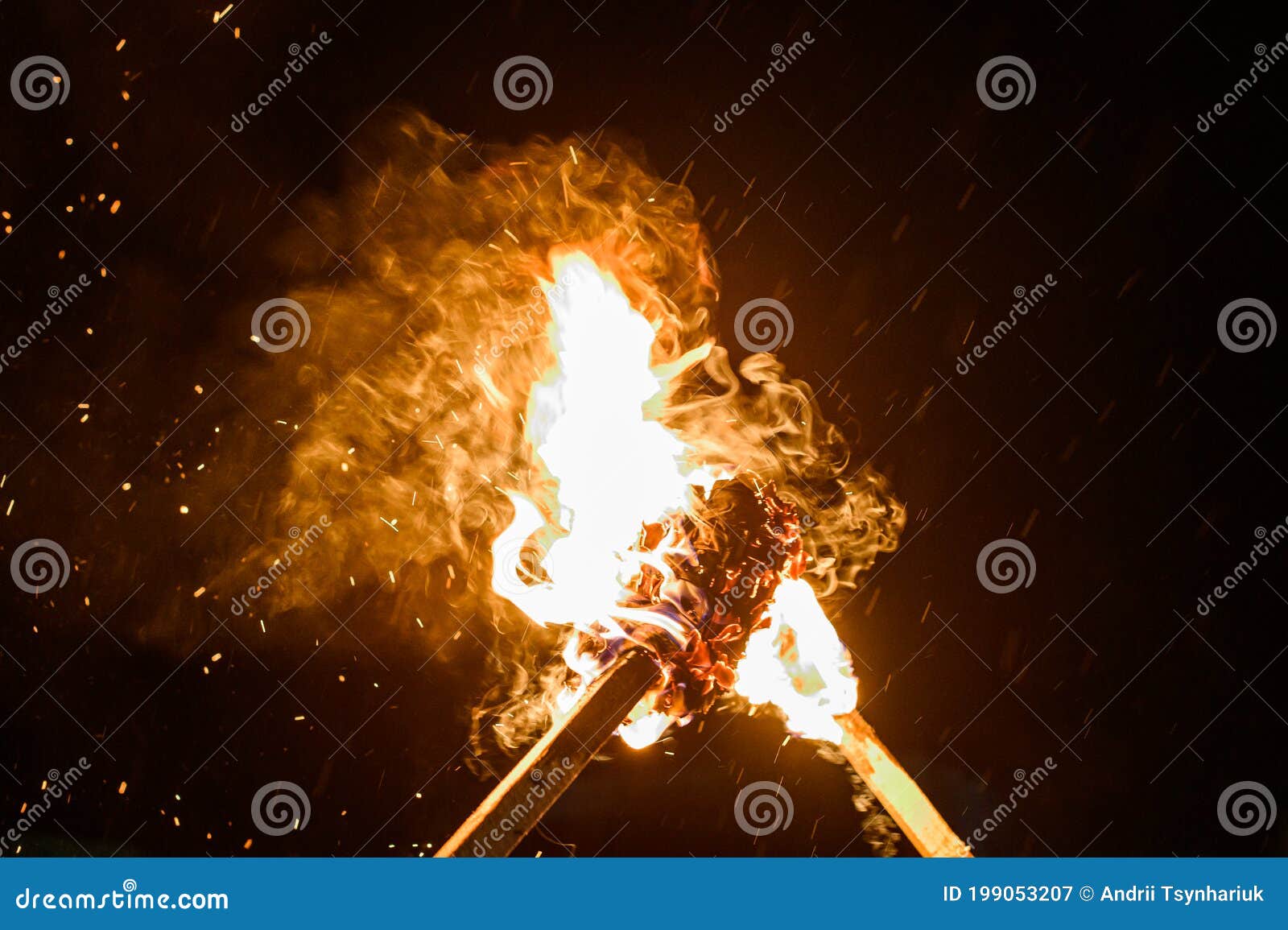 Two Burning Torches On A Dark Background Smoke And Fire From Burning