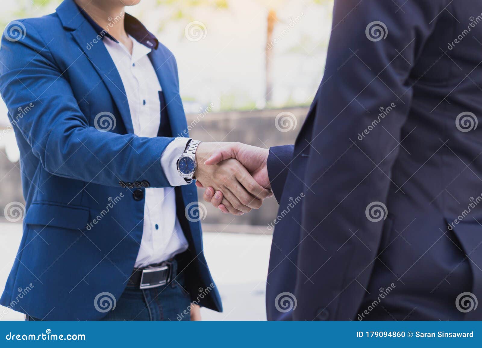 two business man making handshake in the city. business etiquette, congratulation, merger and acquisition 
