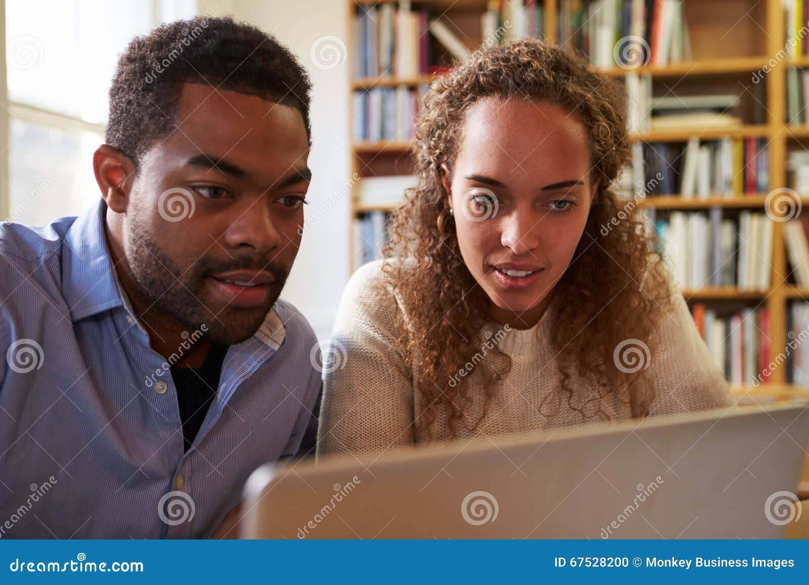 Two Businesspeople Working at Laptop in Office Stock Photo Image of