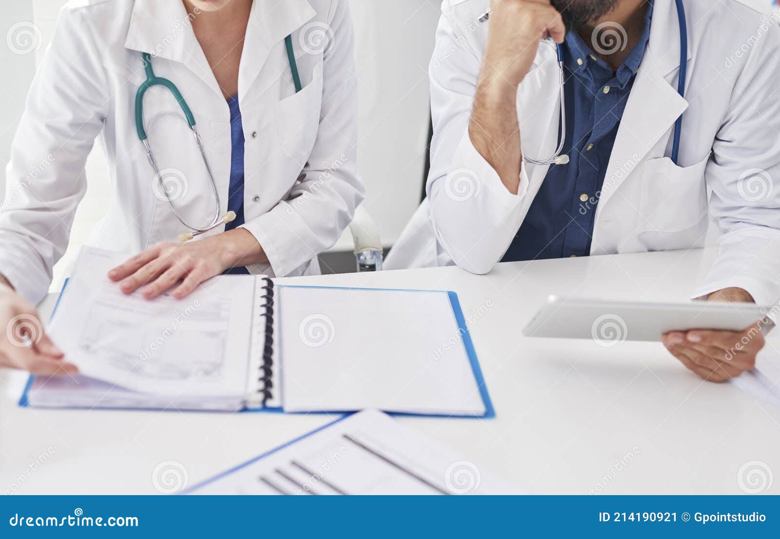 two busy doctors checking medical results