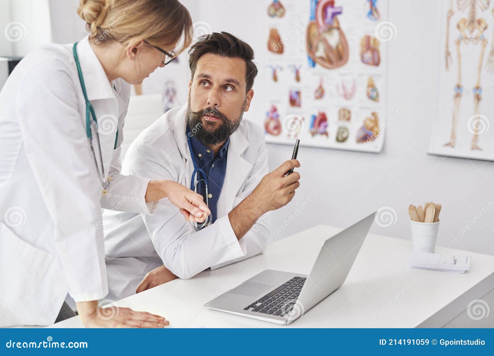 two busy doctors over the laptop