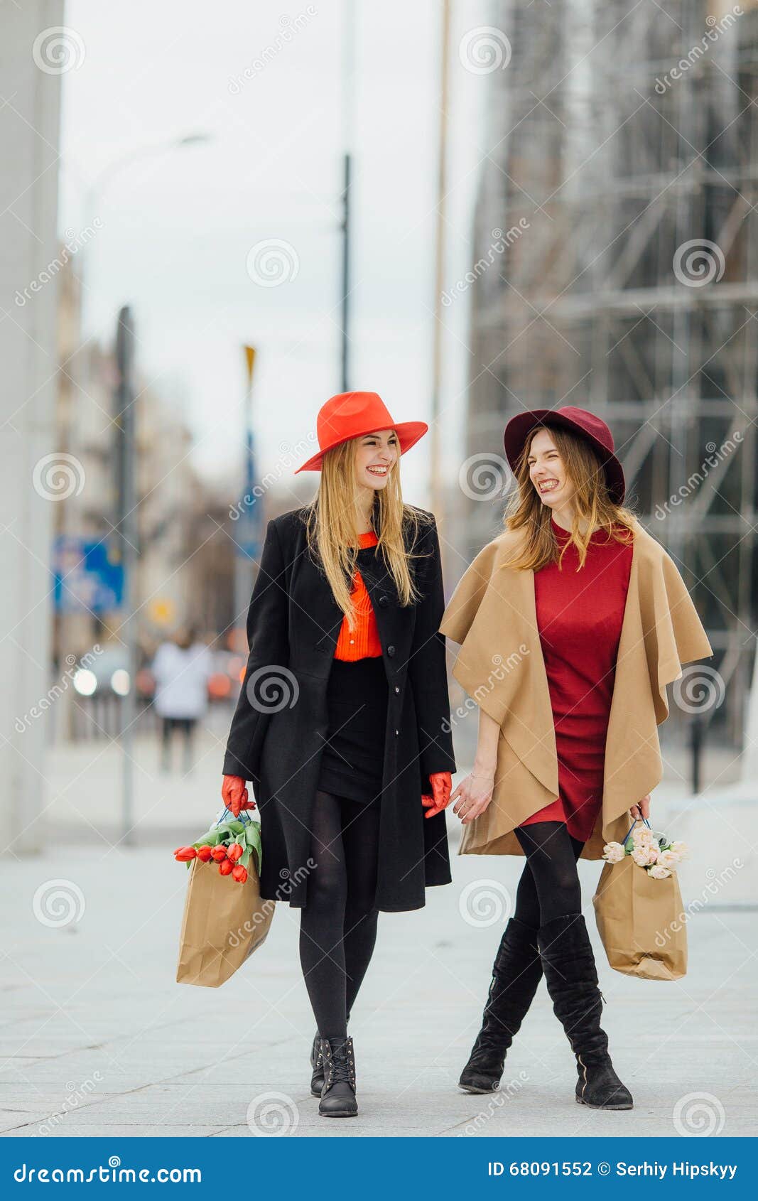 Two Busy Woman Walking on the Street, Talking with Each Other Stock ...