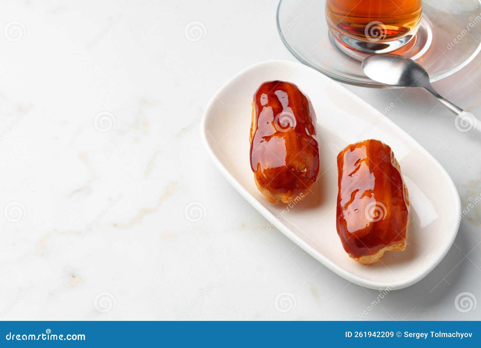 Two Caramel Eclairs on a White Plate Stock Image Image of kitchen