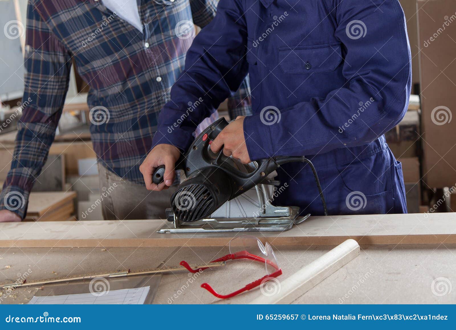 Two carpenters working stock image. Image of releases 65259657