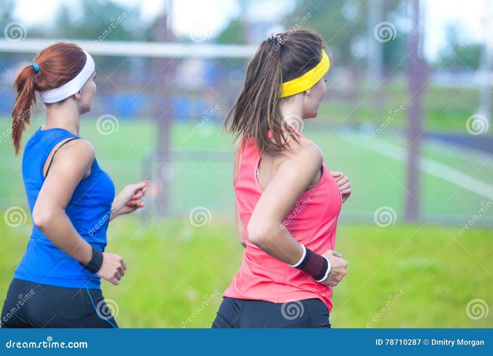 Two Caucasian Sport Athletes Having Jogging Exercises Together Outdoors