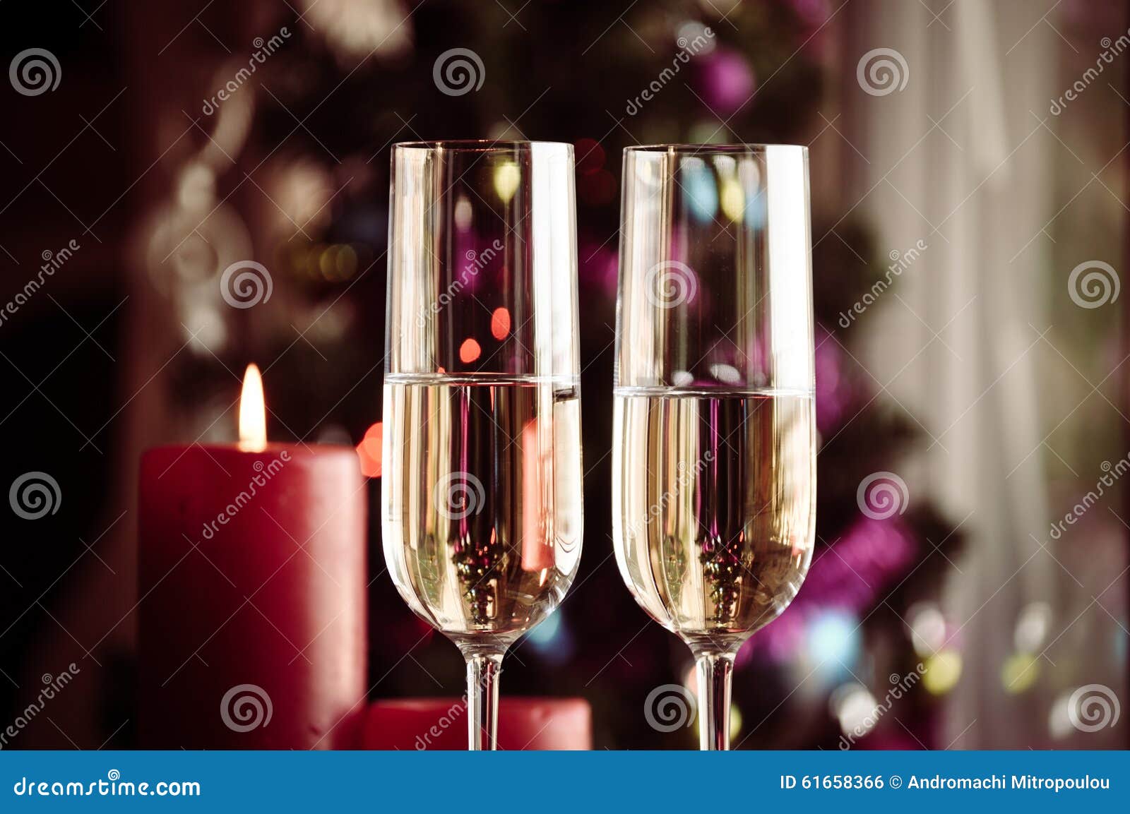 two champagner glasses on glass table with bokeh background