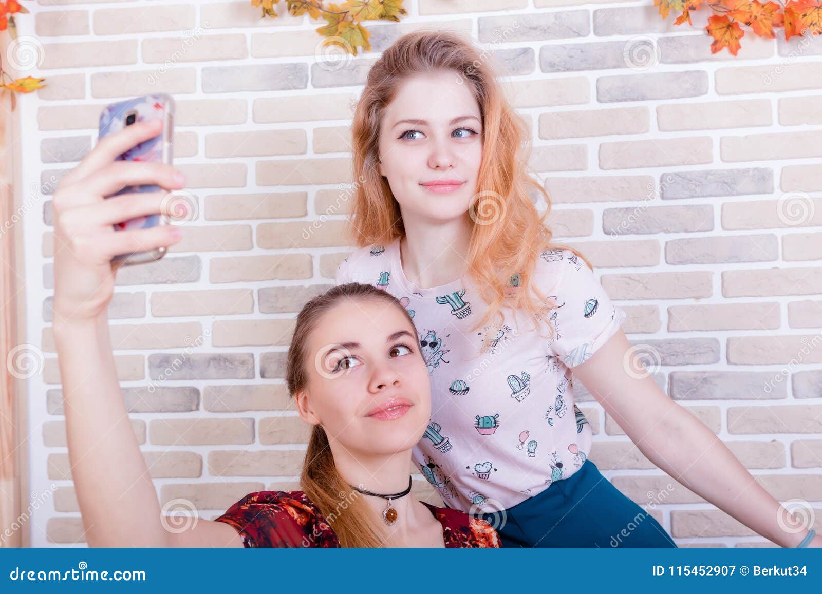 Two Charming Young Girls Take a Selfie on Phone Stock Image - Image of ...