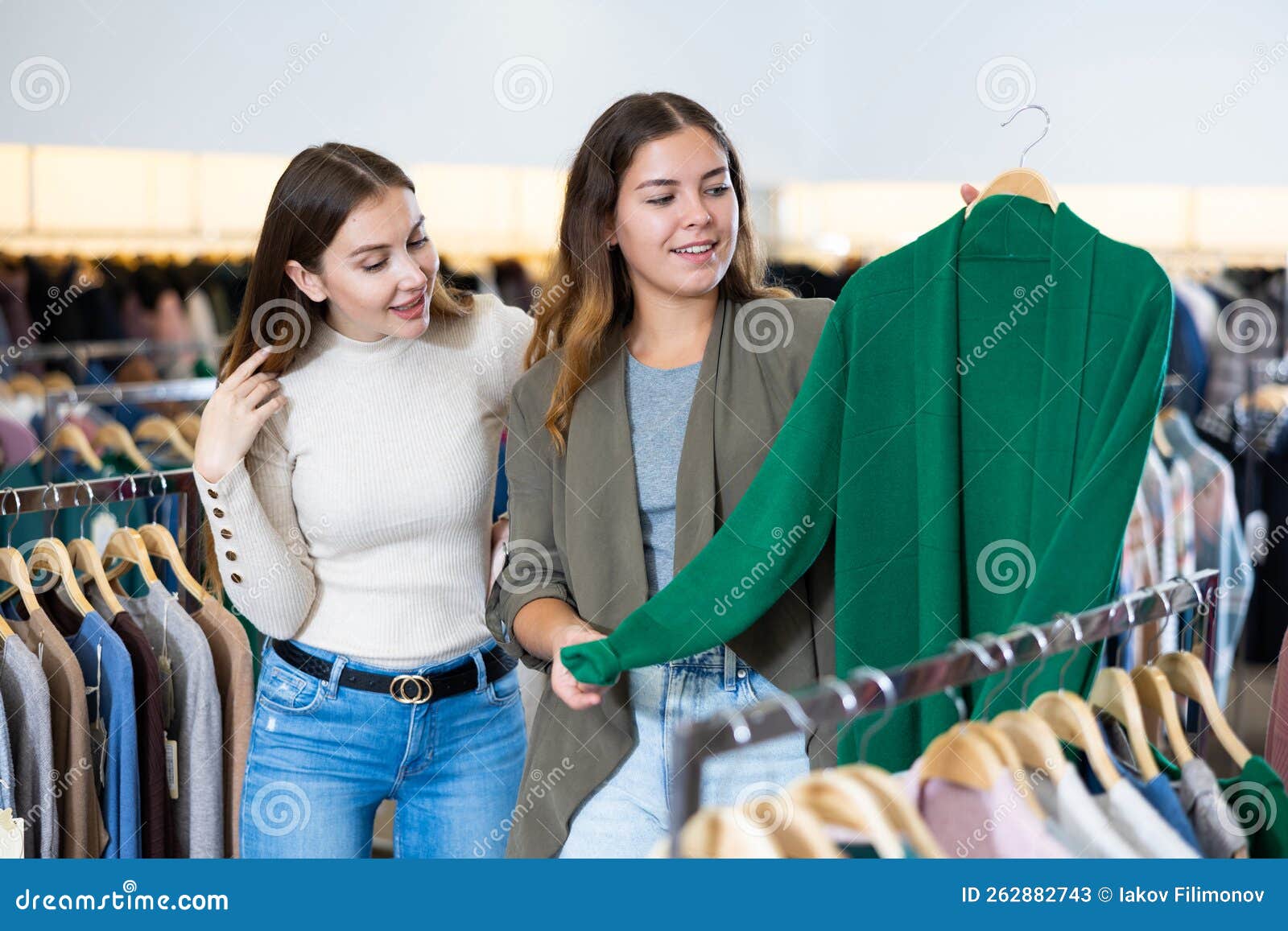 Two Cheerful Women Shopping in Outerwear Clothing Boutique Stock Image ...