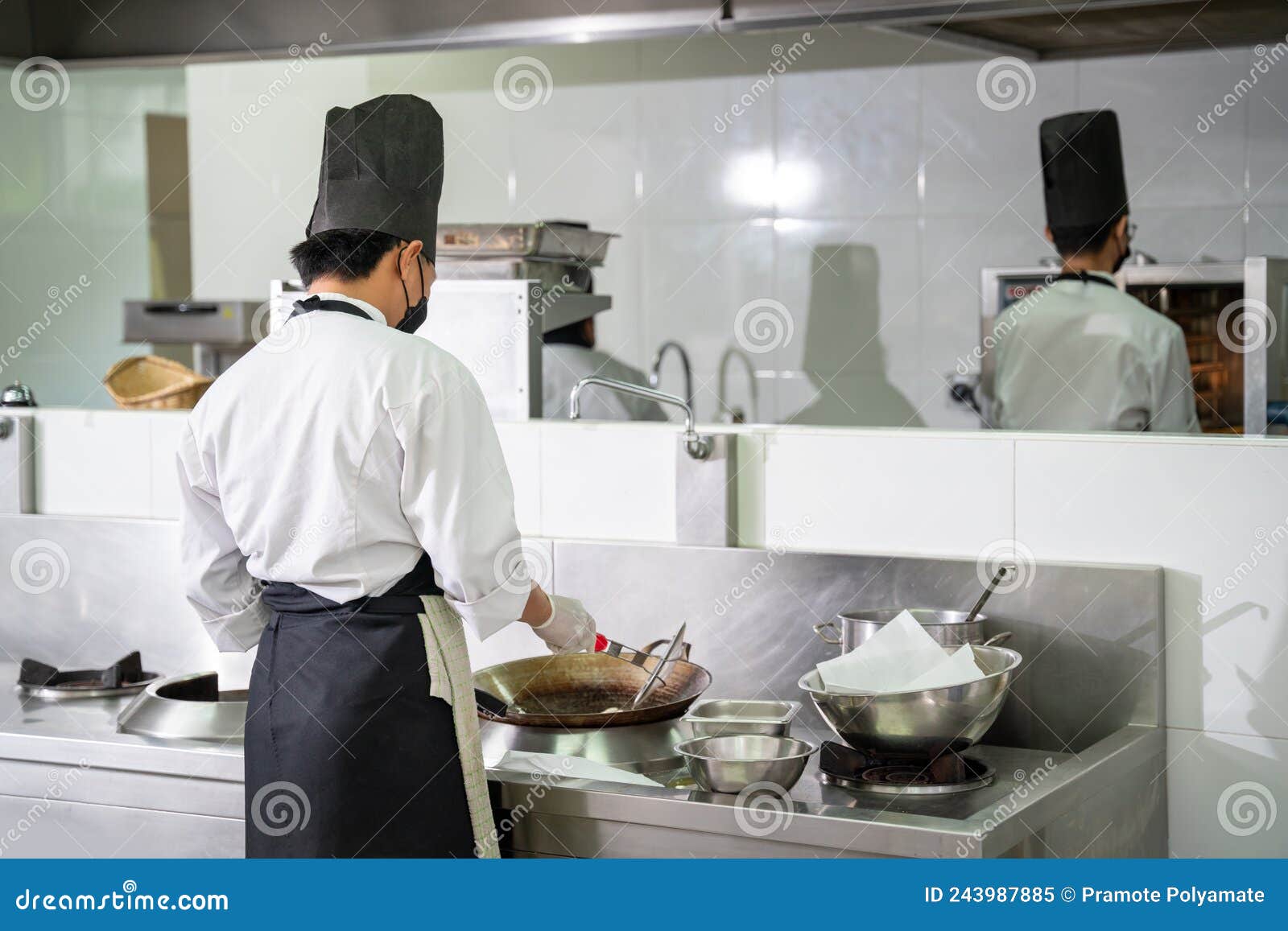 Two Chefs Prepare Meals in the Restaurant`s Kitchen. Modern Kitchen