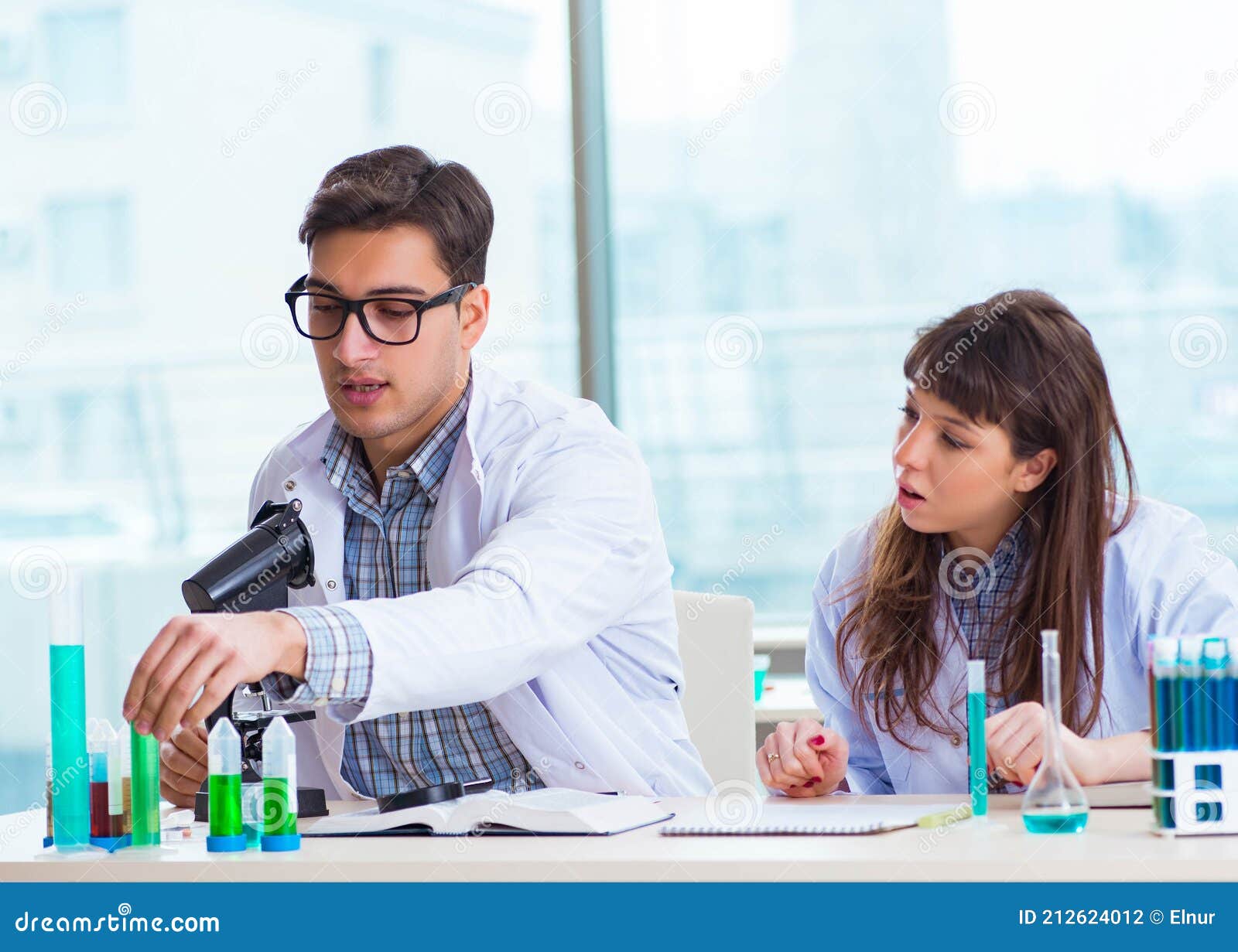 Two Chemists Working in Lab Experimenting Stock Photo Image of doctor