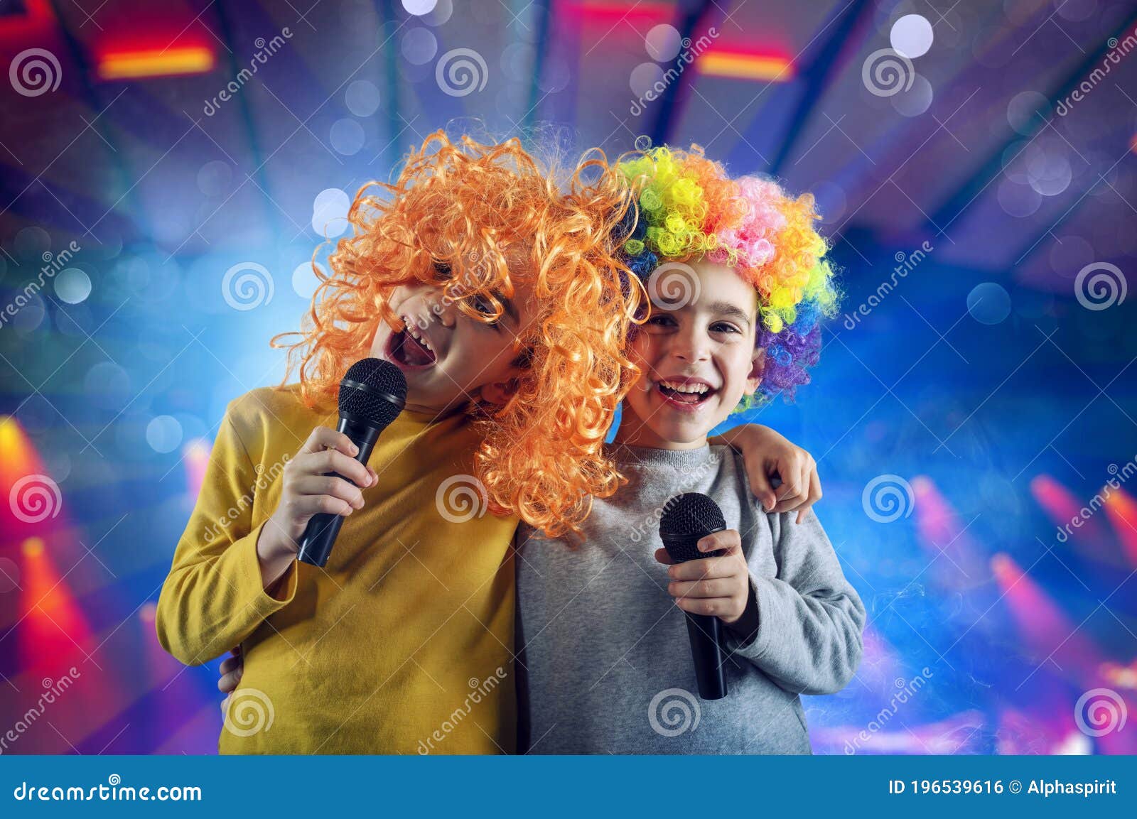 two child sing a song with microphone and funny wig