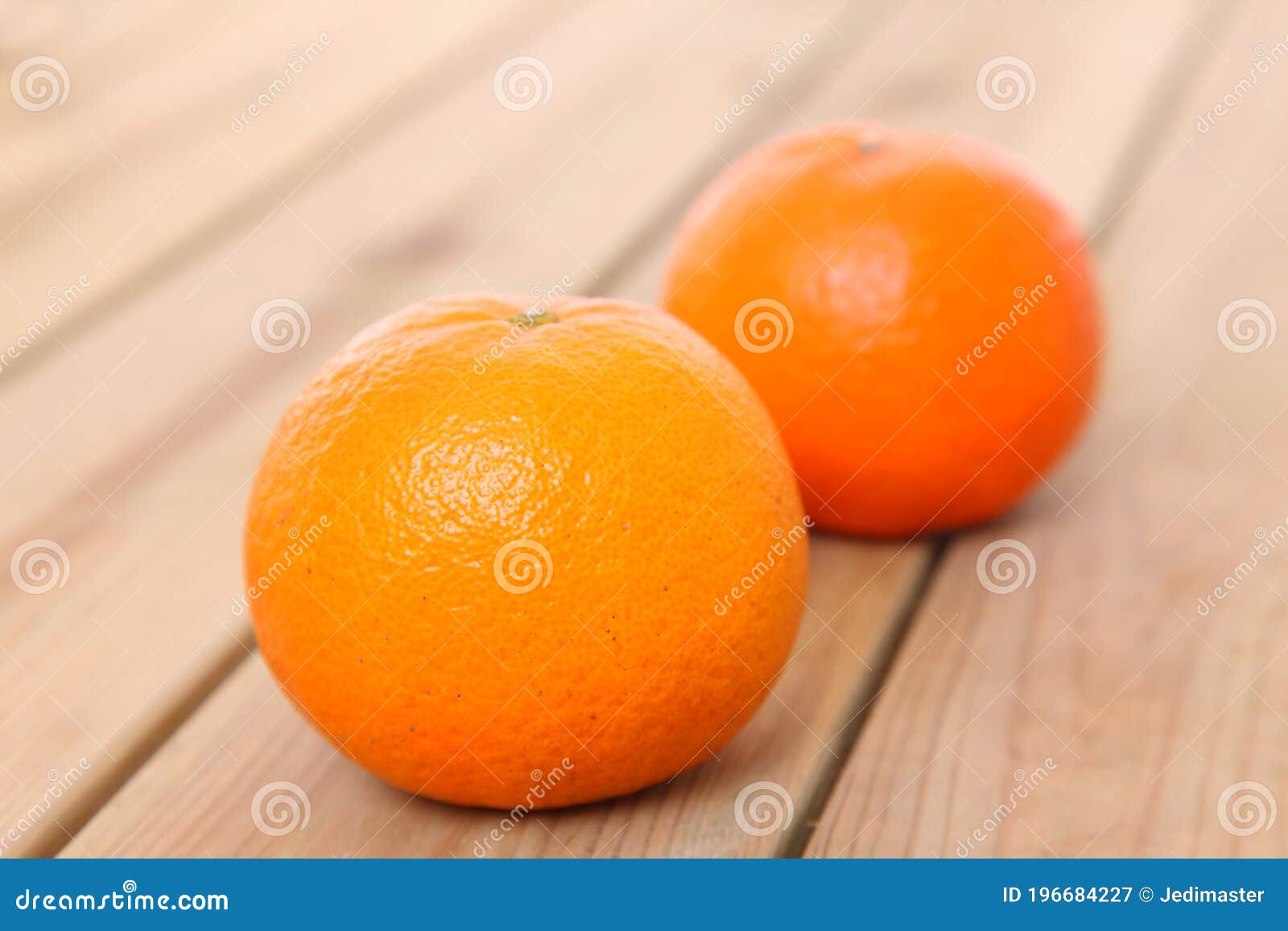 two citrus tankan against wooden background