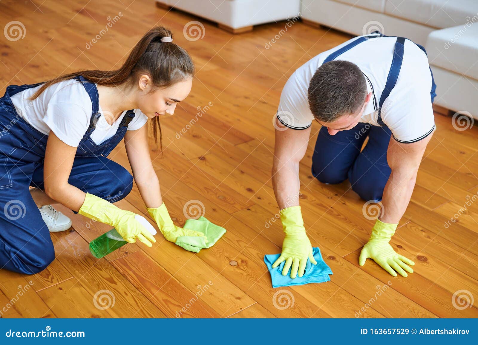 Two Cleaners Polish Wooden Floor With Rag Stock Image Image Of