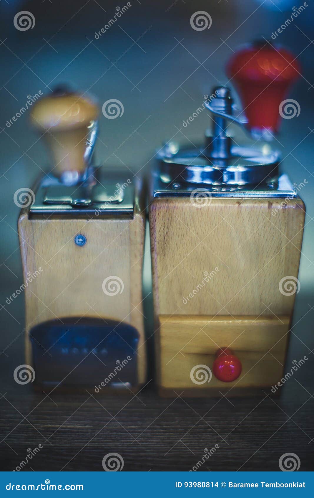 Two Coffee Grinder Old Style and at Blur Background Stock Photo Image