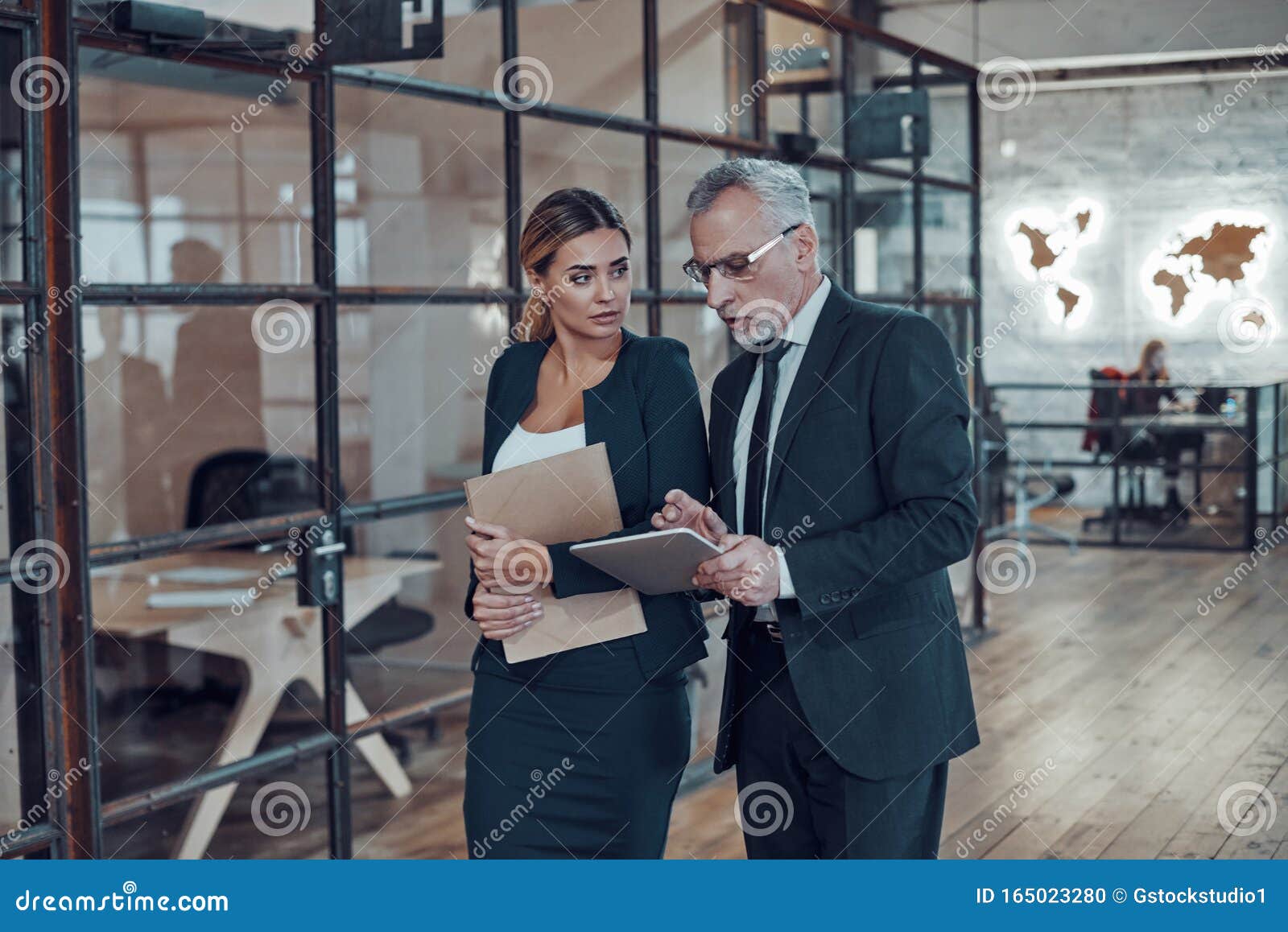 two colleagues in elegant formalwear