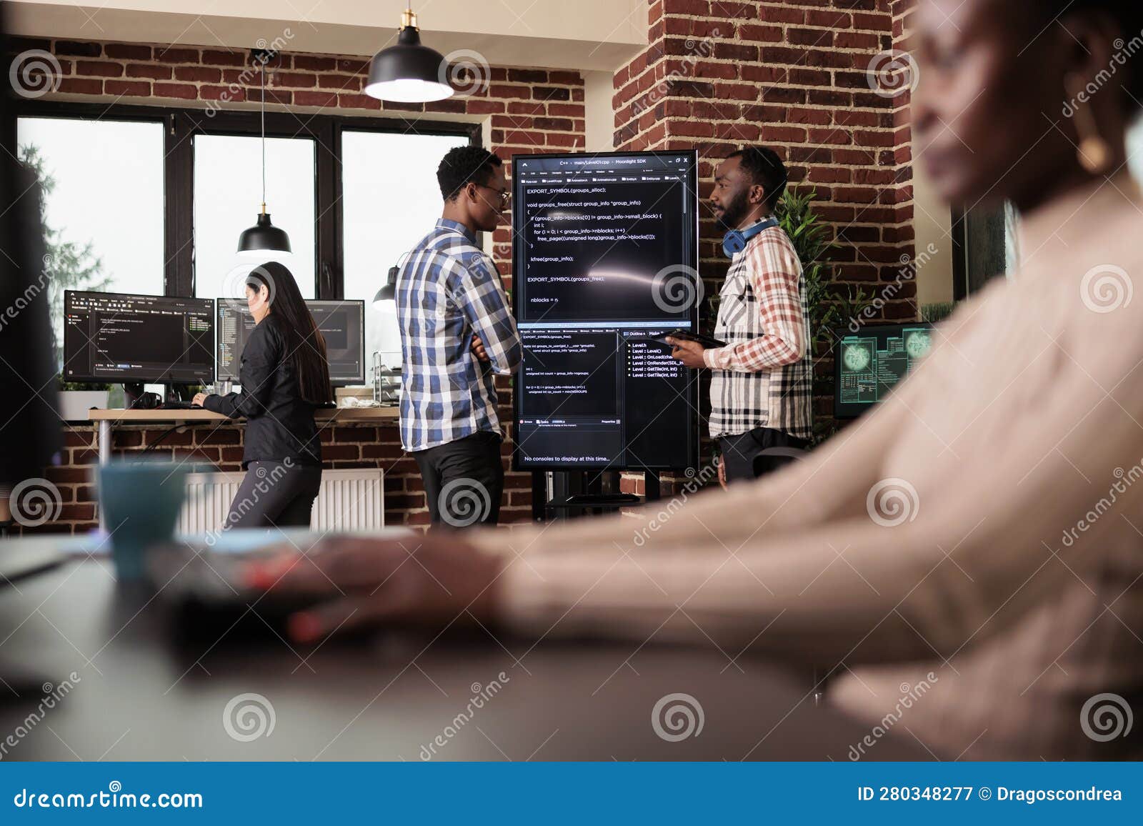 two of company programming engineers analyzing html code