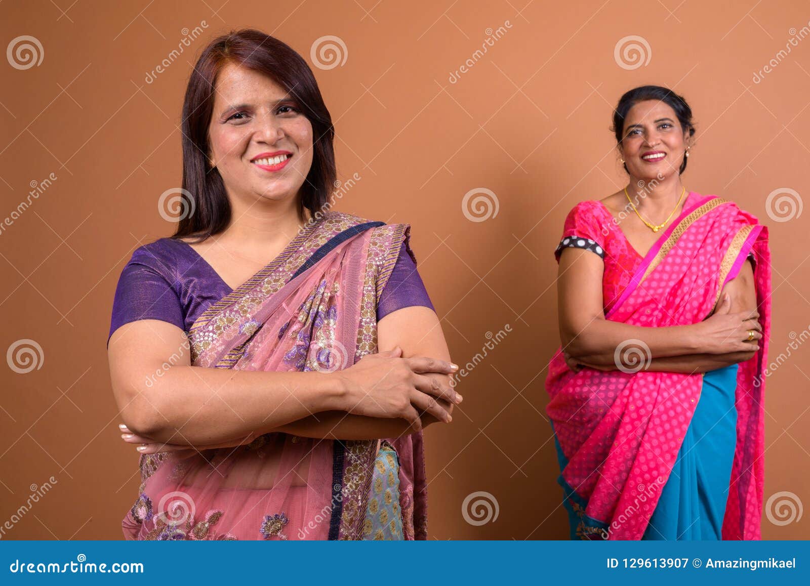 Two Confident Indian Woman Smiling With Arms Crossed Stock Image