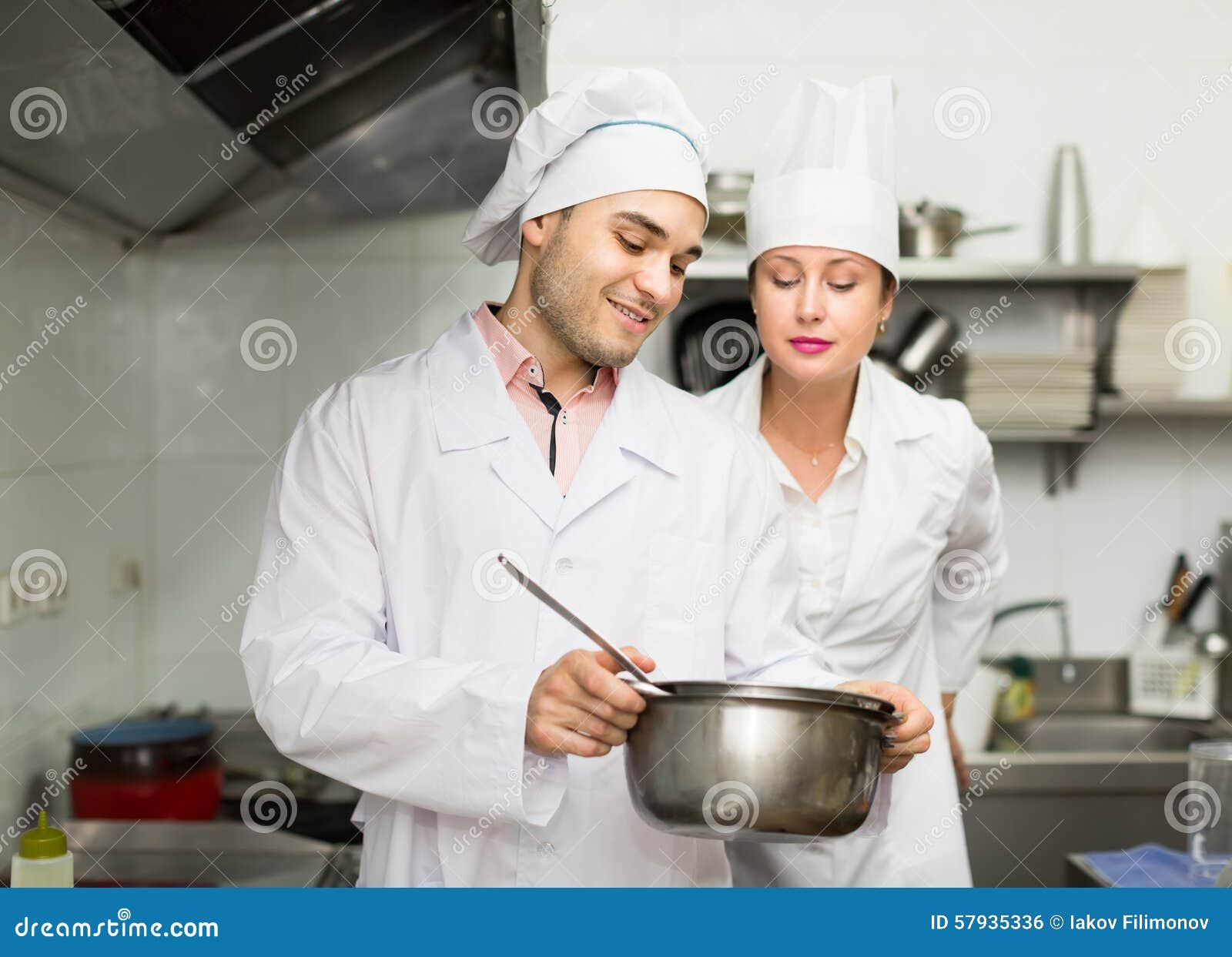 Two Cooks at Restaurant Kitchen Stock Photo Image of cafe, bistro 57935336
