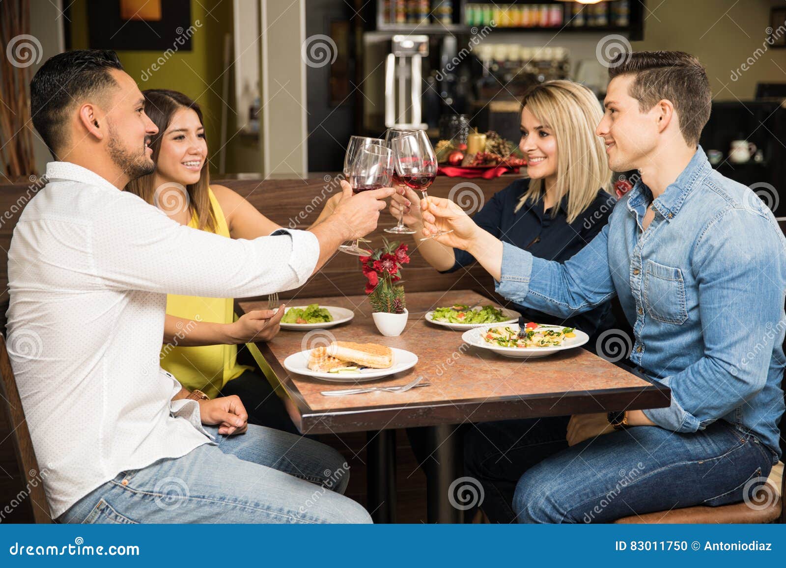 Two Couples Eating Out Together Stock Photo - Image of boyfriend