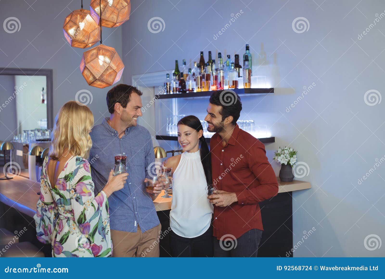 Two Couples Having Cocktails Together Stock Photo Image of glass
