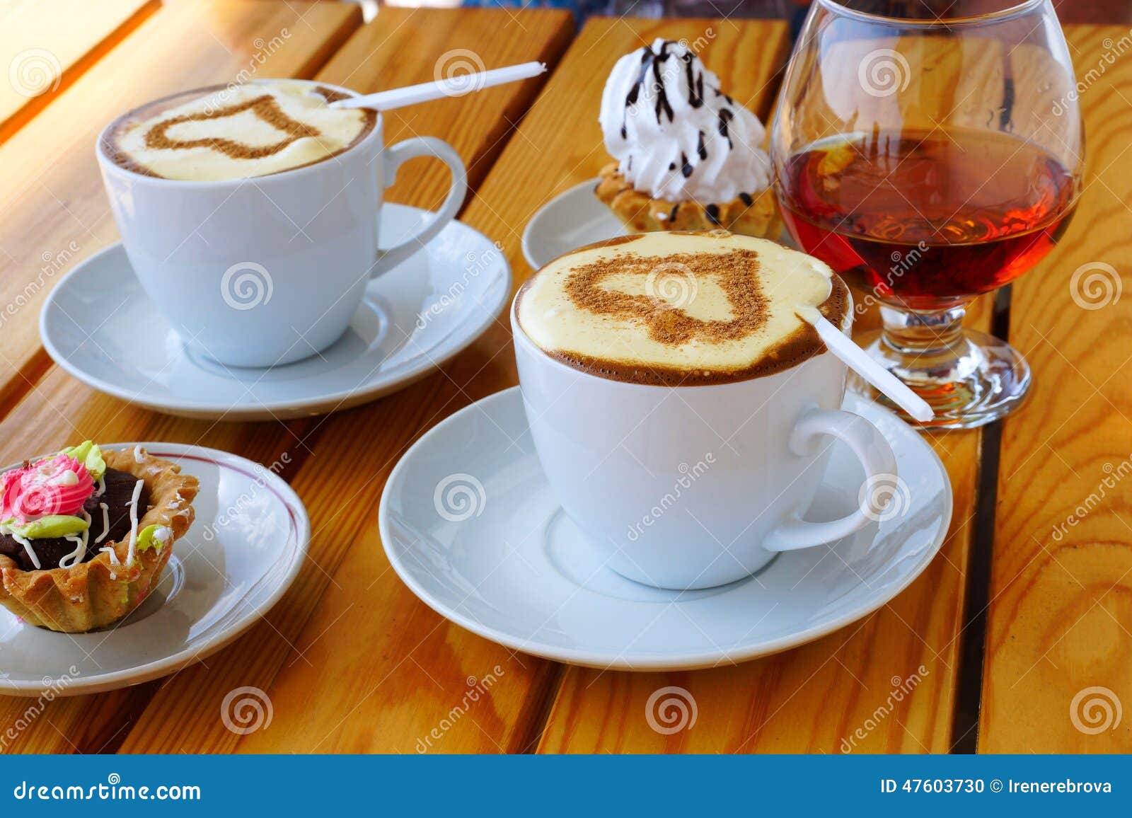 Two Cups of Coffee, a Wineglass of Brandy and Cake Stock Photo Image