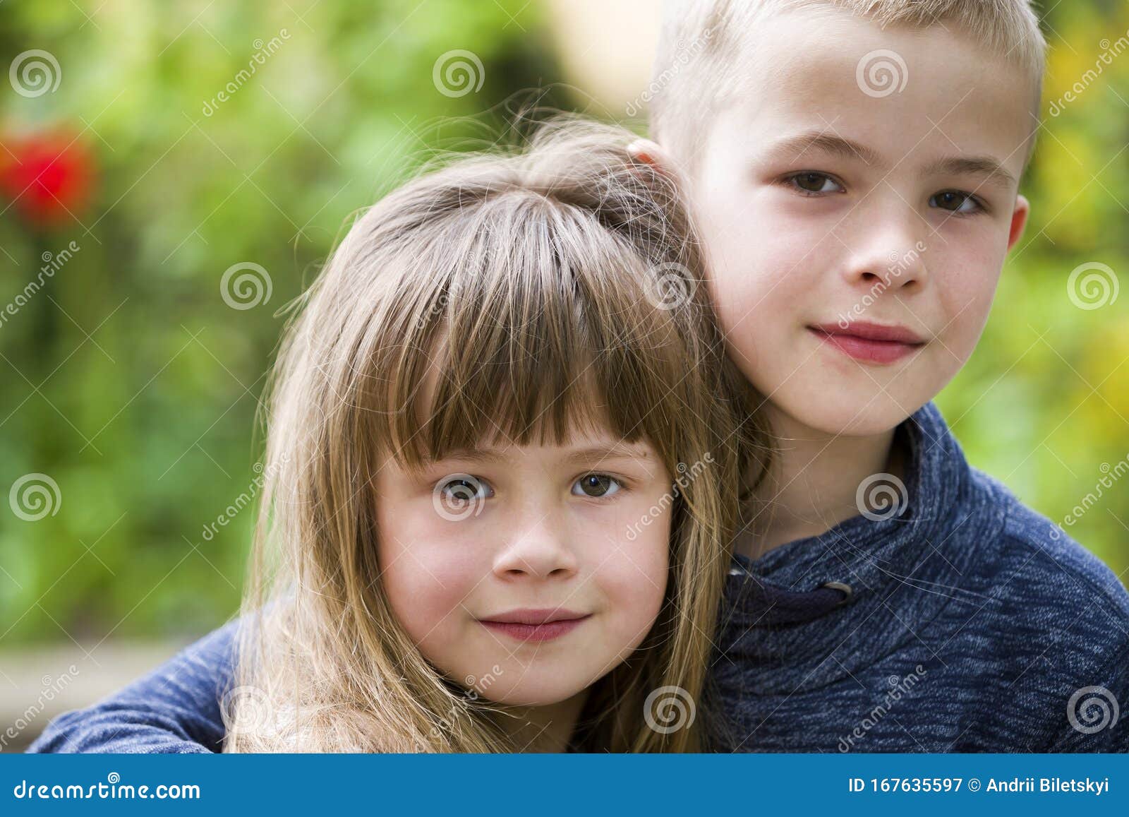Two Cute Fair-haired Children Siblings, Young Boy Brother Embracing
