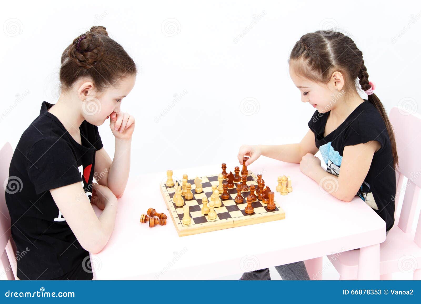 Two Cute Girls Play Chess. Black Rook Move. Stock Image Image of