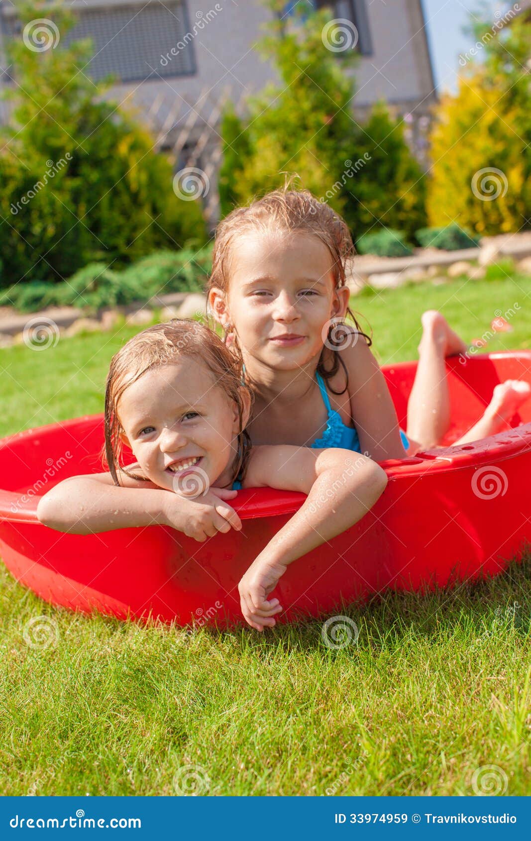 Two Cute Little Happy Girls Having Fun In