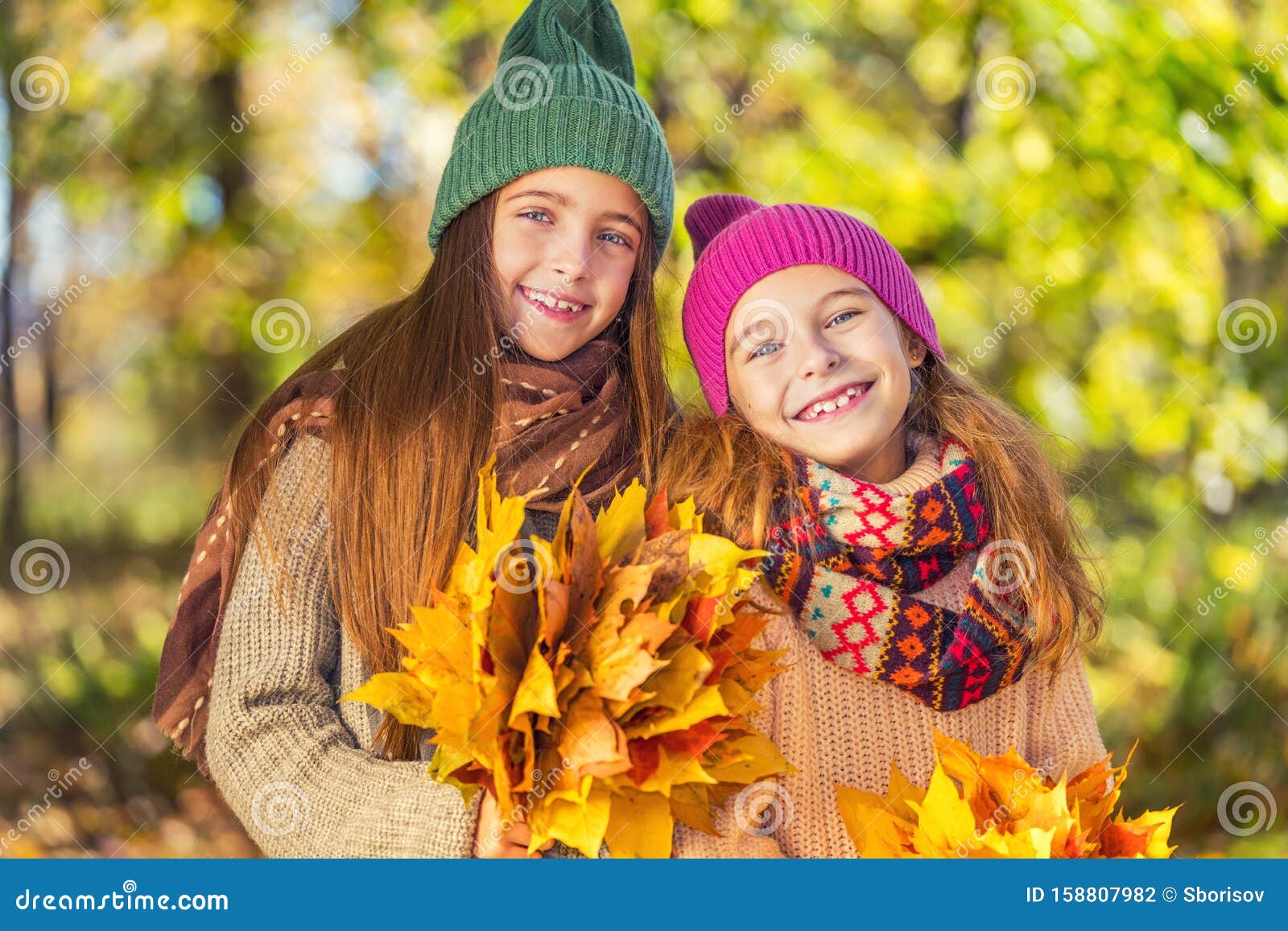Two Cute Smiling 8 Years Old Girls Posing Together in a Park on a Sunny ...