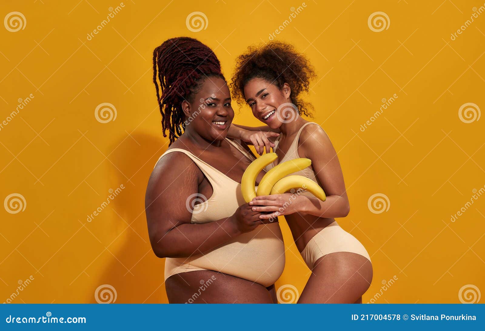 Two Female Beauties In A Dancing Pose Stock Photo, Picture and Royalty Free  Image. Image 12006990.