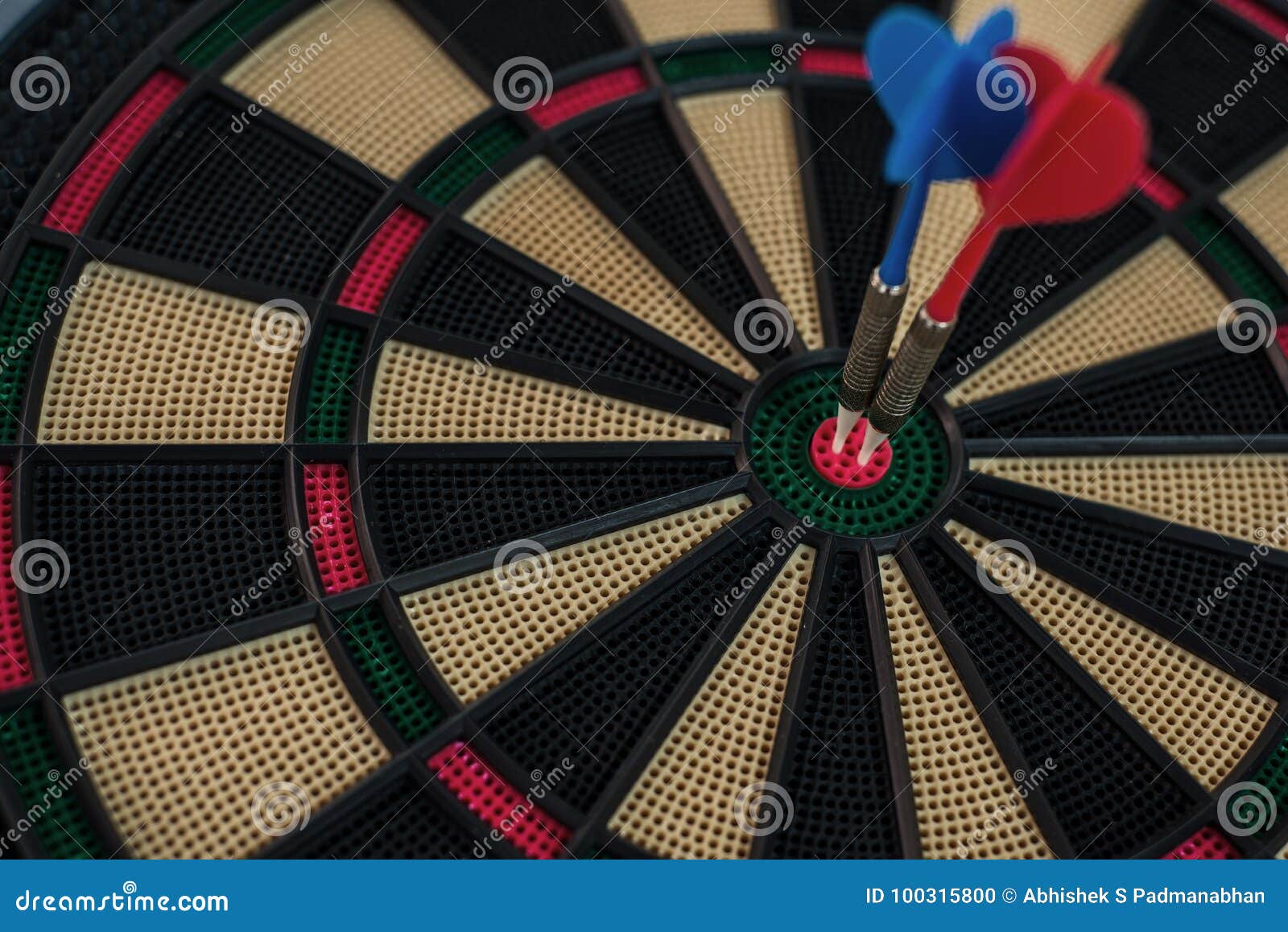 Two darts on a dart board stock photo. Image of darts 100315800
